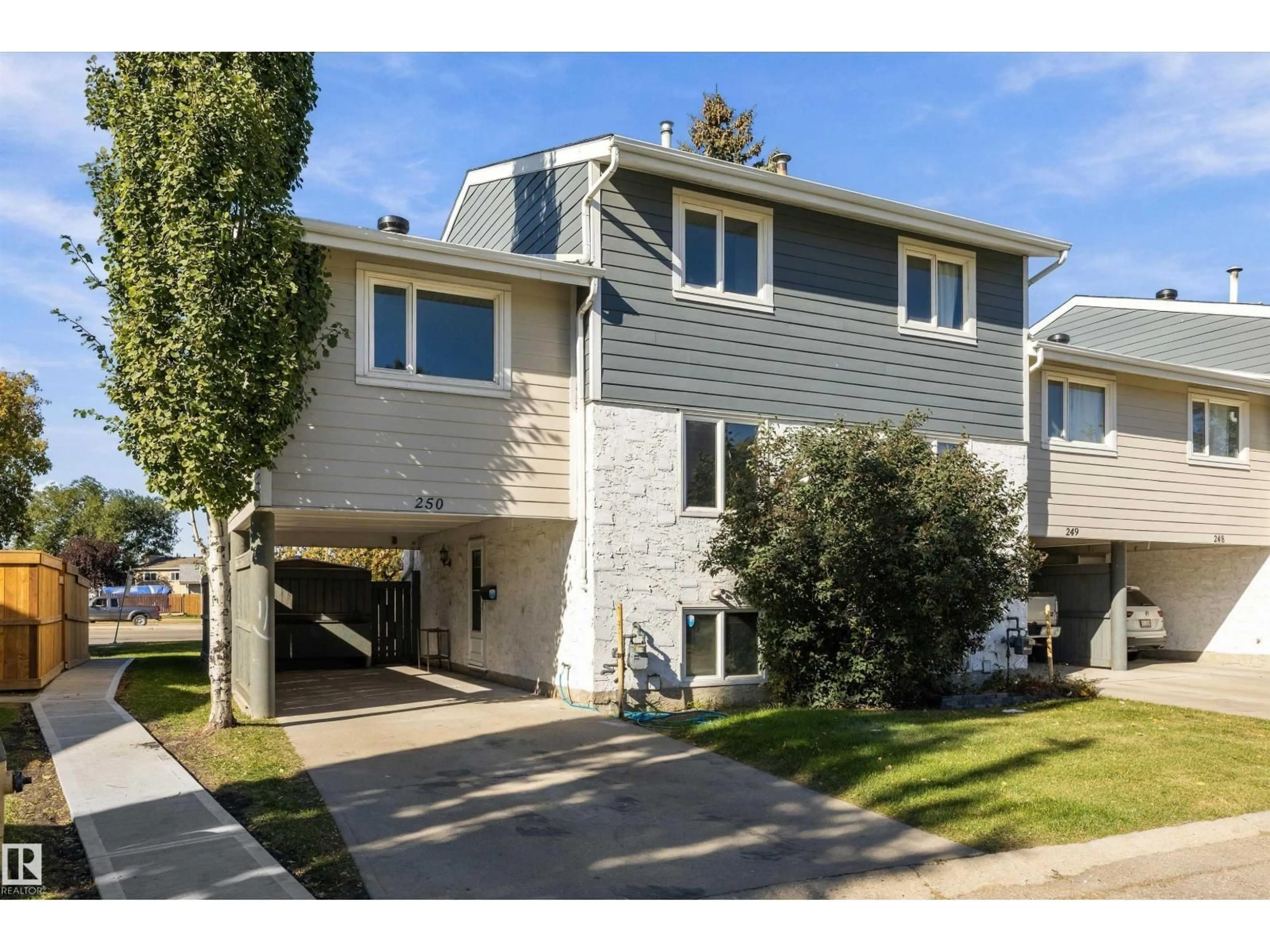 Home with vinyl exterior material, street for TWO - 250 CALLINGWOOD NW, Edmonton Alberta T5T1A3