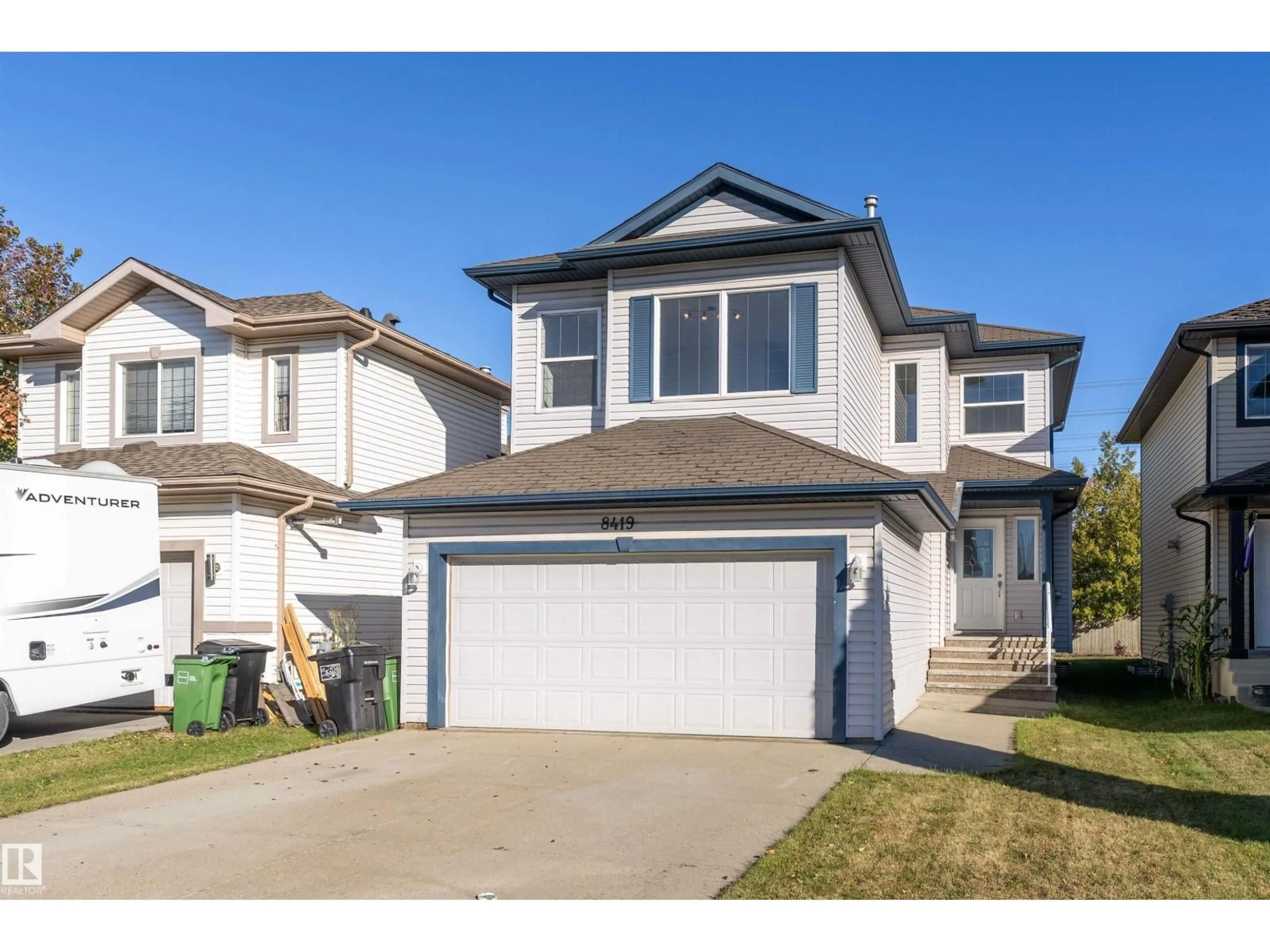 Home with vinyl exterior material, street for SW - 8419 2 AV, Edmonton Alberta T6X1H5