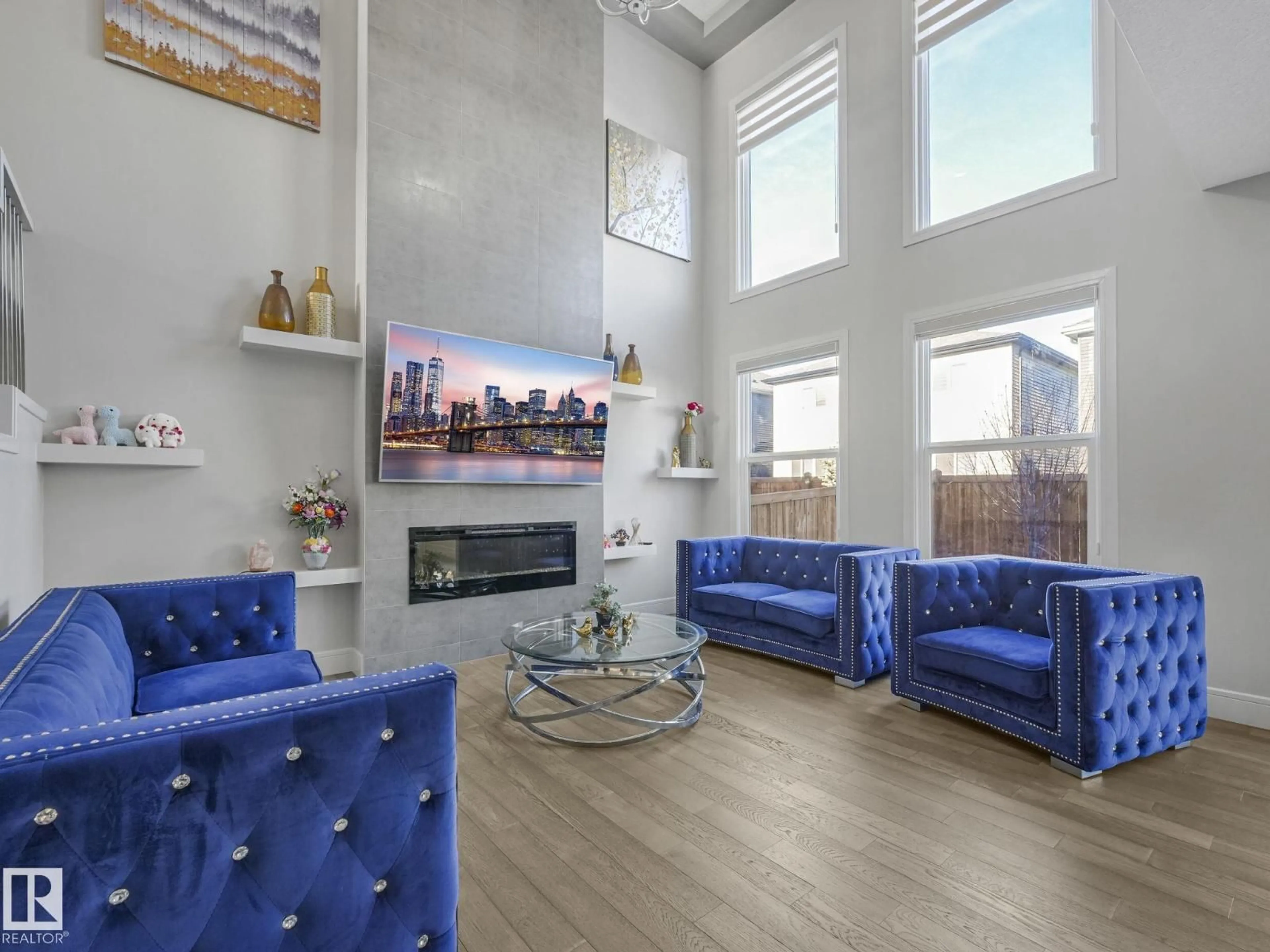 Living room with furniture, wood/laminate floor for SW - 8641 MAYDAY WD, Edmonton Alberta T6X2L1
