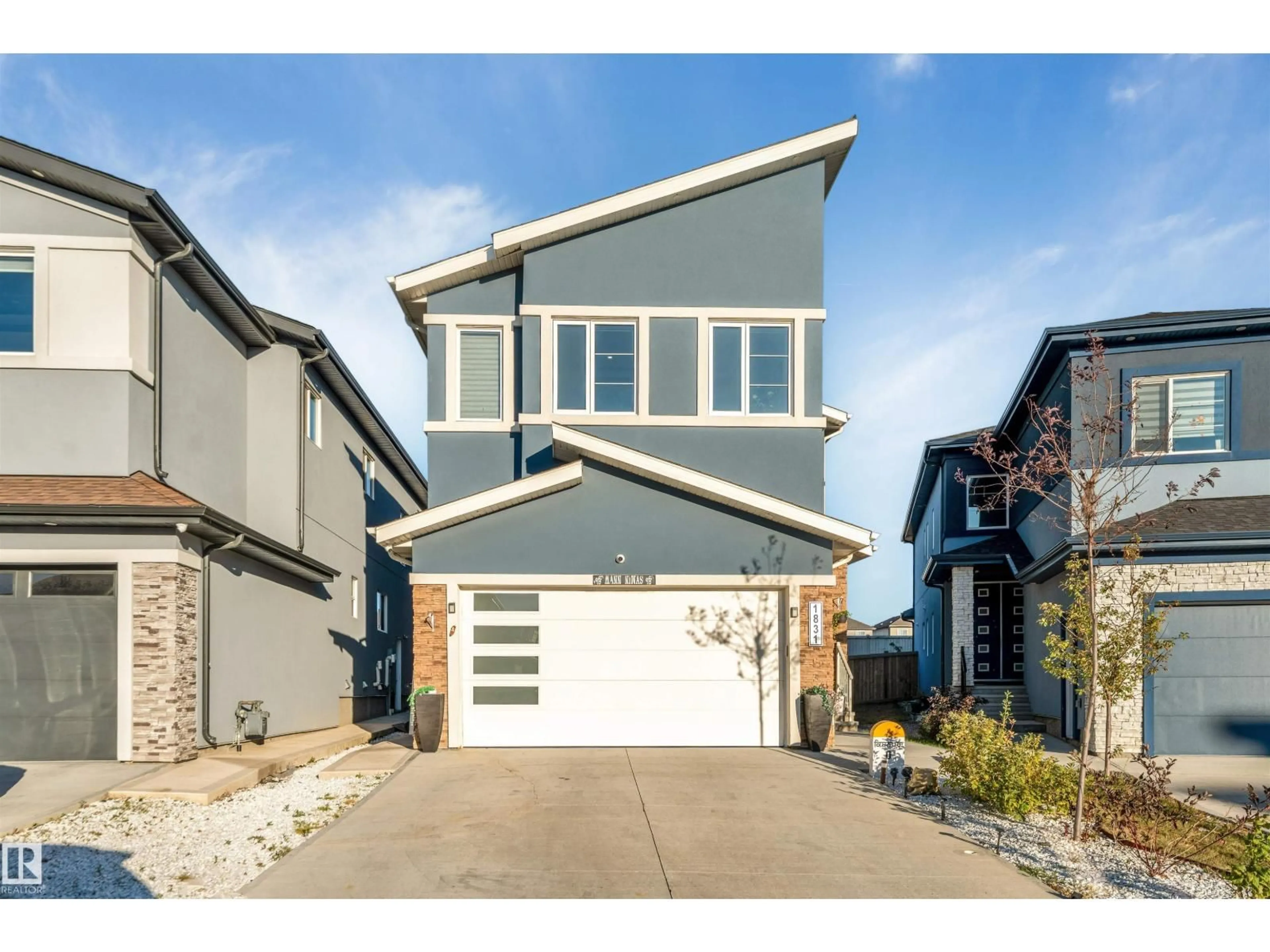 Home with vinyl exterior material, street for NW - 1831 18 ST, Edmonton Alberta T6T2M9