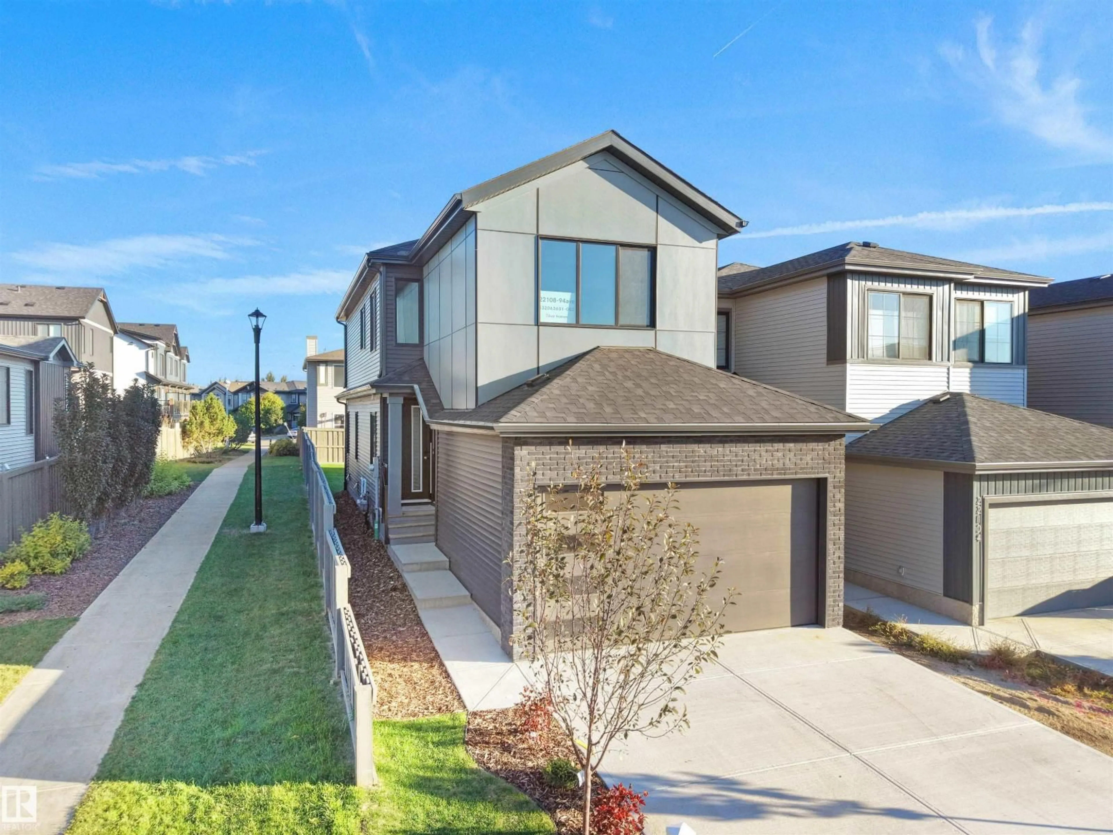 Home with brick exterior material, street for 22108 94 AV, Edmonton Alberta T5T7T6