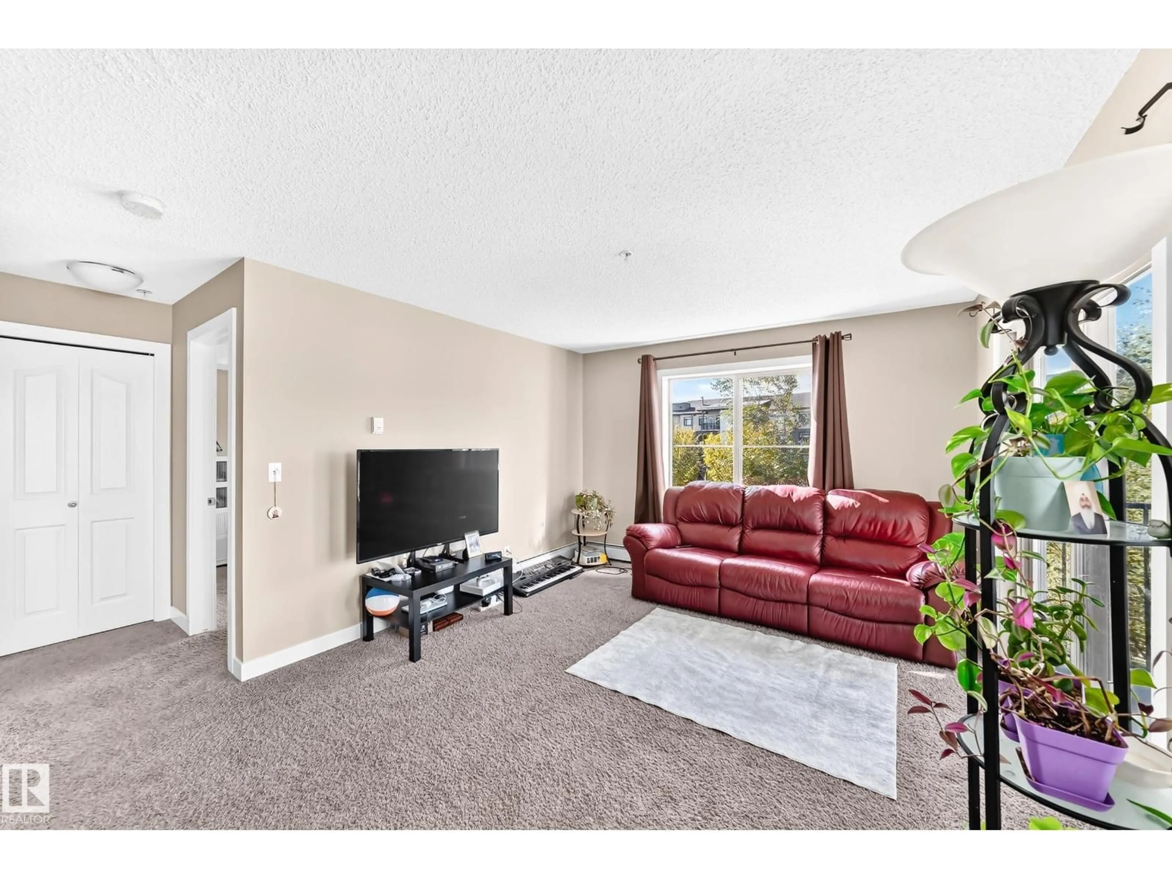 Living room with furniture, carpet floor for #314 - 11820 22 AV, Edmonton Alberta T6W2A2