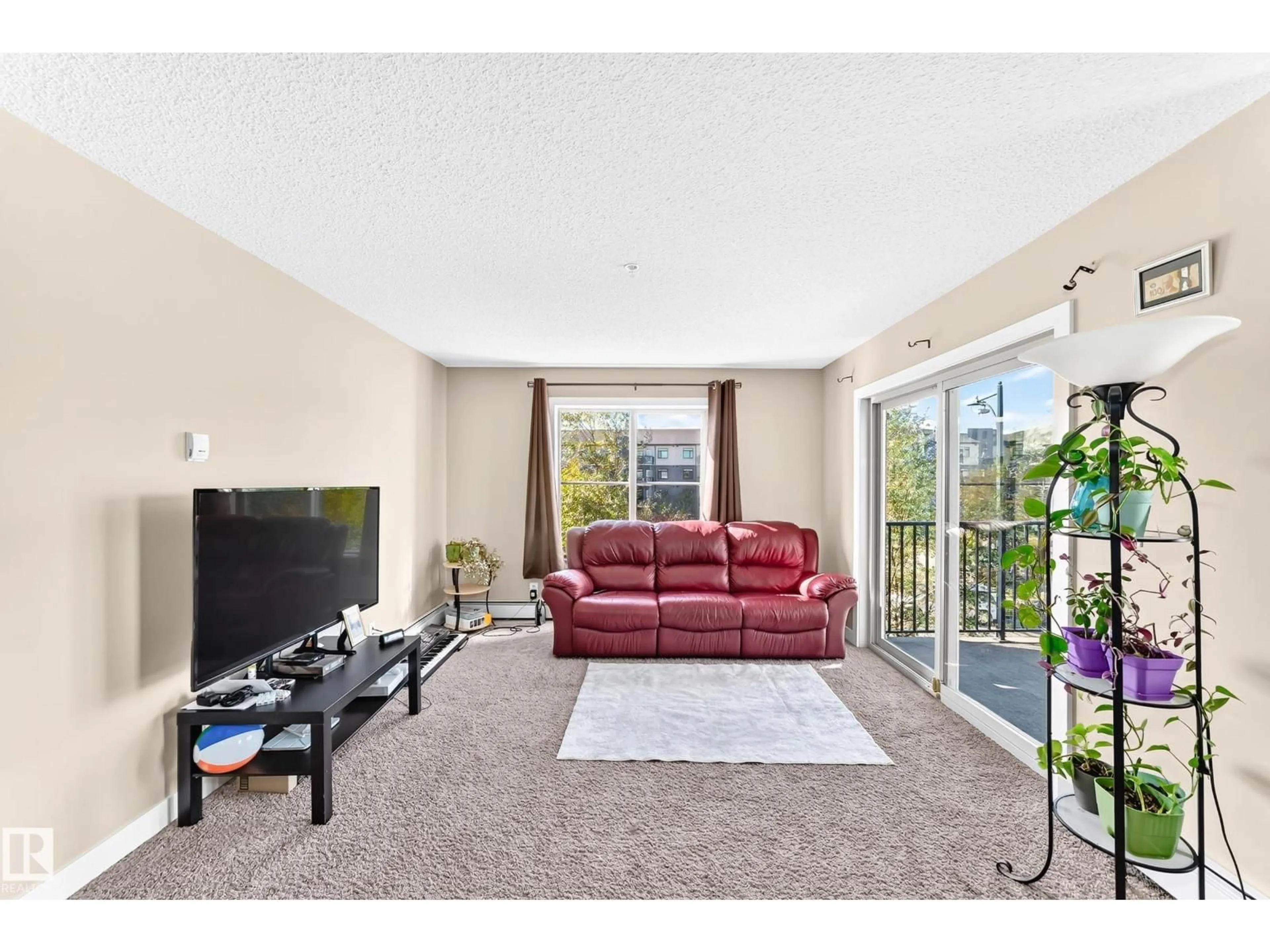 Living room with furniture, unknown for #314 - 11820 22 AV, Edmonton Alberta T6W2A2