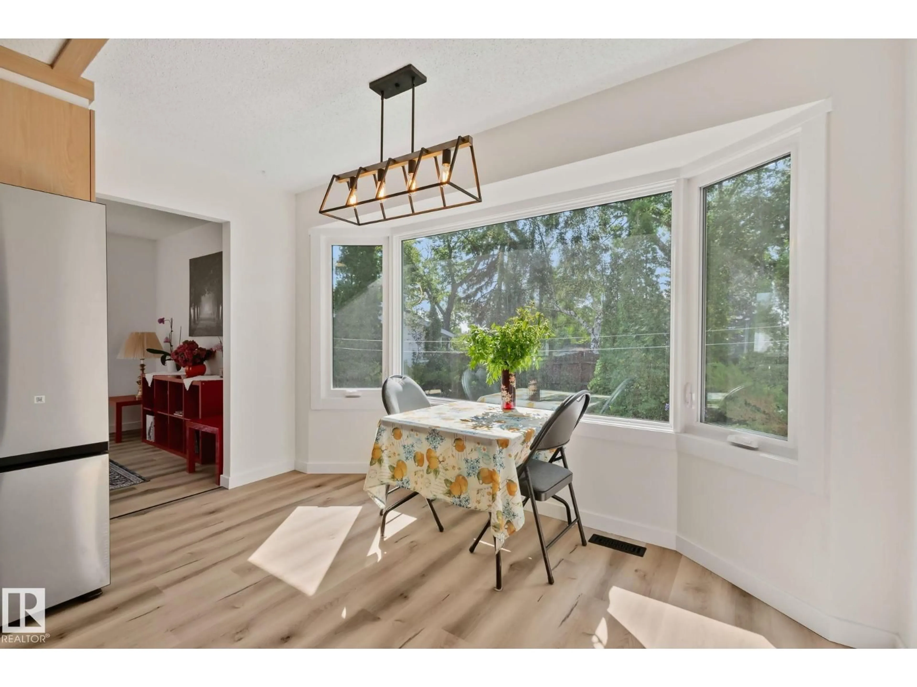 Dining room, wood/laminate floor for 10619 35 AV, Edmonton Alberta T6J2V8