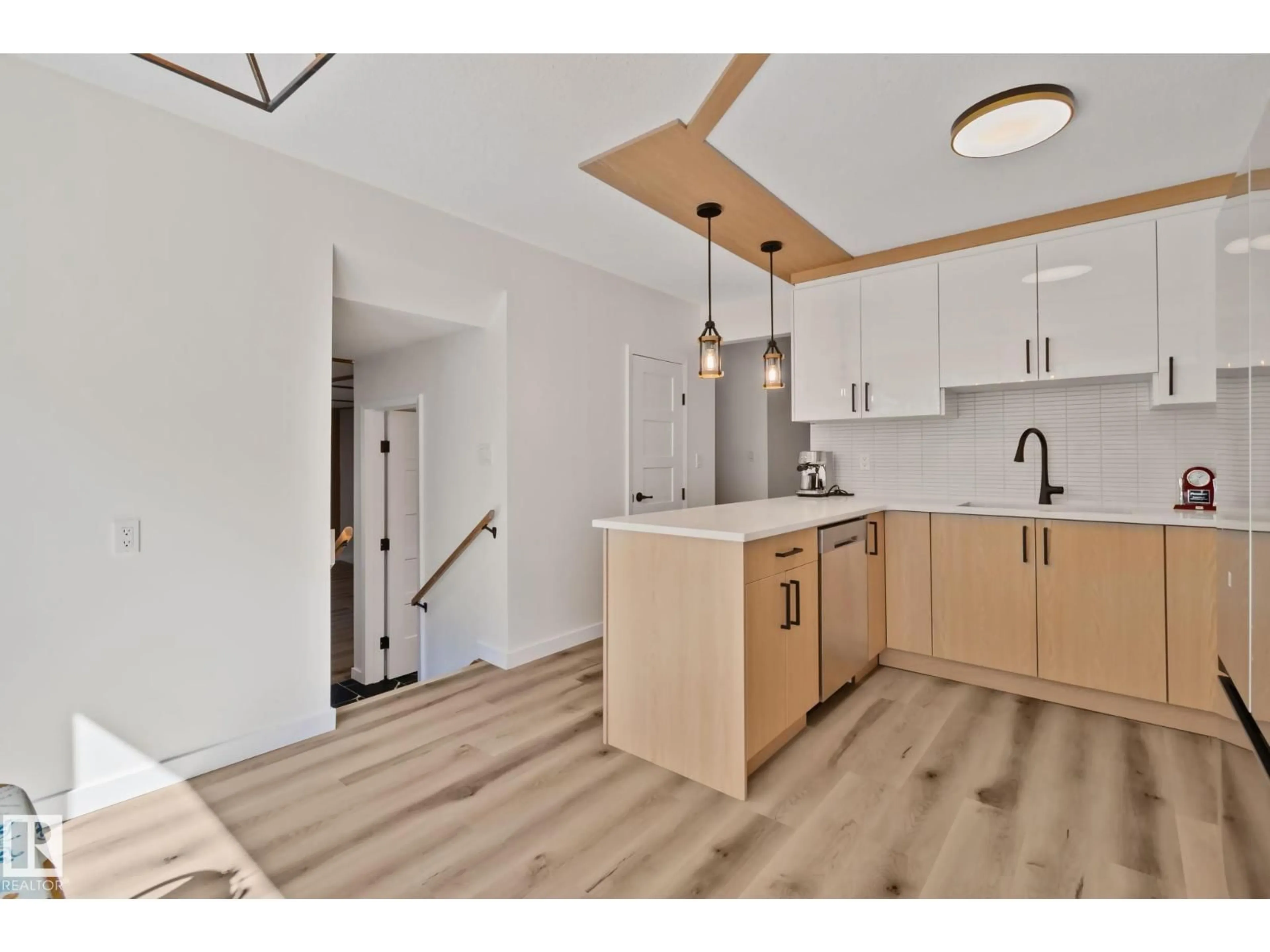 Open concept kitchen, wood/laminate floor for 10619 35 AV, Edmonton Alberta T6J2V8