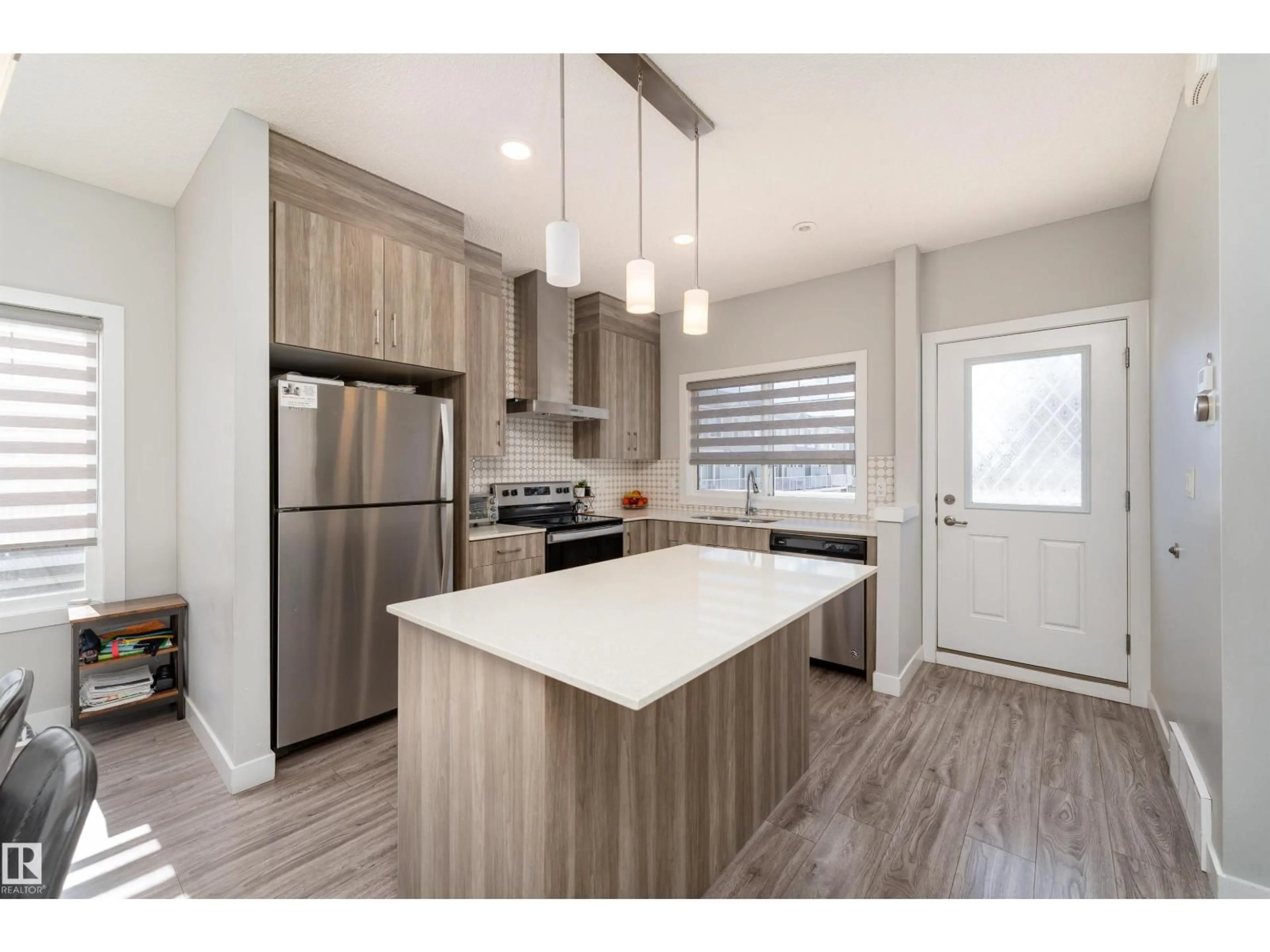 Open concept kitchen, wood/laminate floor for #41 - 2215 24 ST, Edmonton Alberta T6T1A6