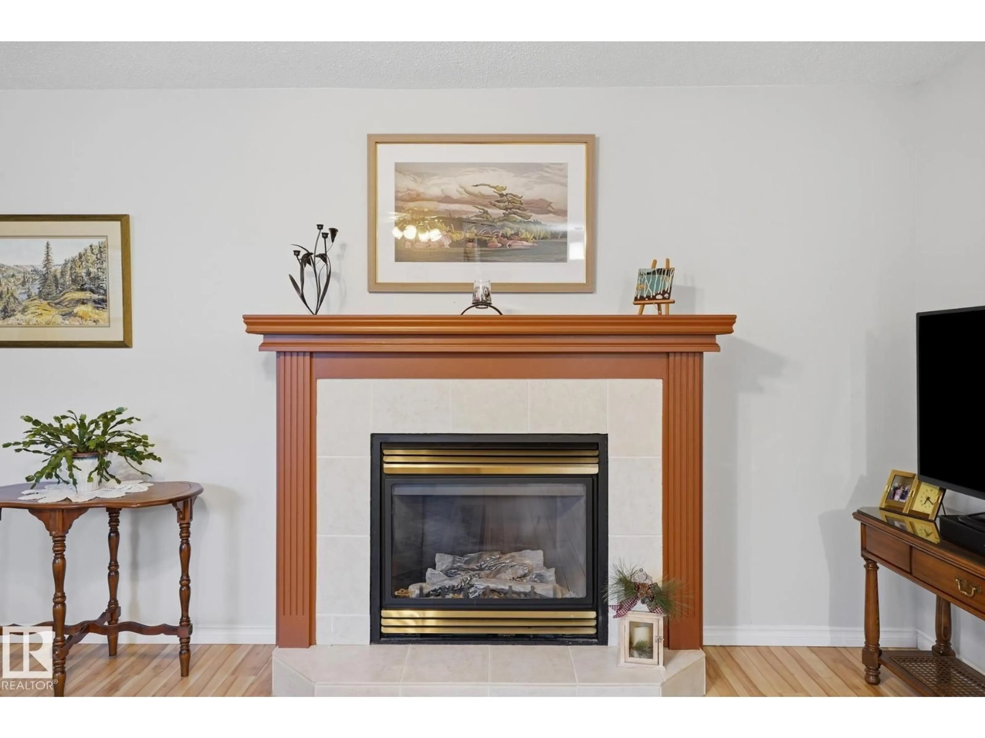 Living room with furniture, wood/laminate floor for NW - 5763 189 ST, Edmonton Alberta T6M2G9