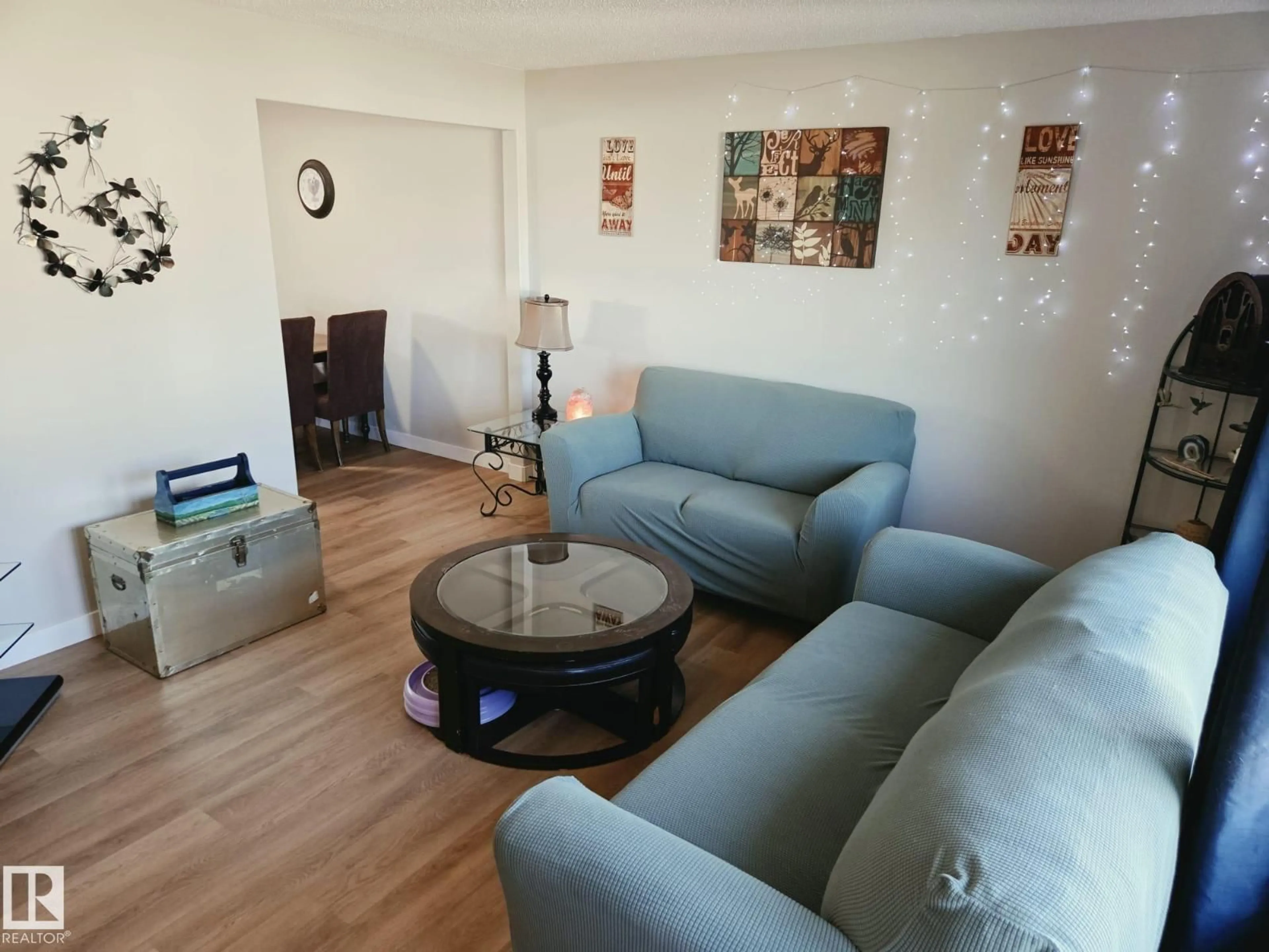 Living room with furniture, wood/laminate floor for 5807 51 AV, Redwater Alberta T0A2W0