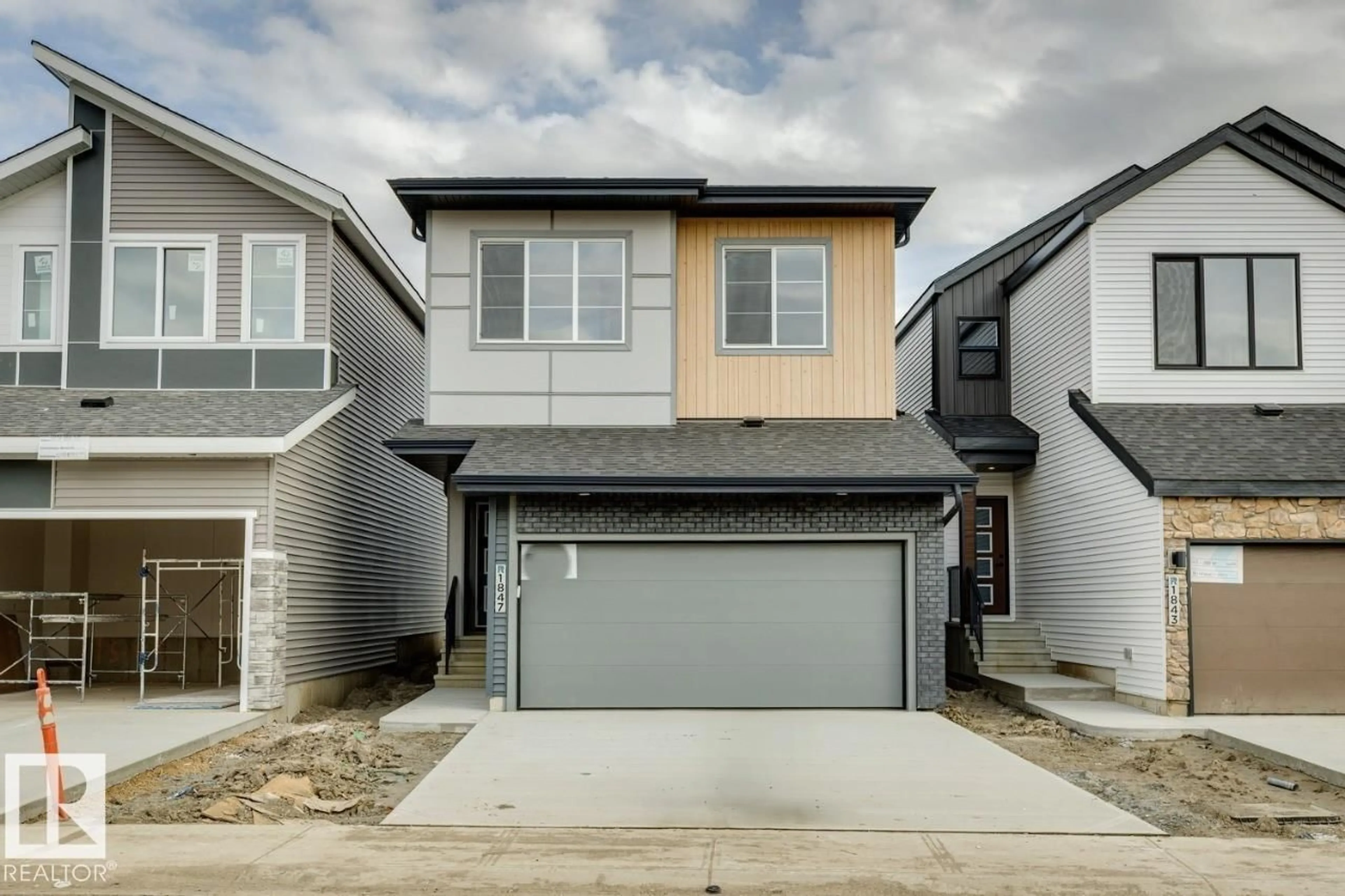 Home with vinyl exterior material, street for NW - 1847 188 ST, Edmonton Alberta T6M3N6