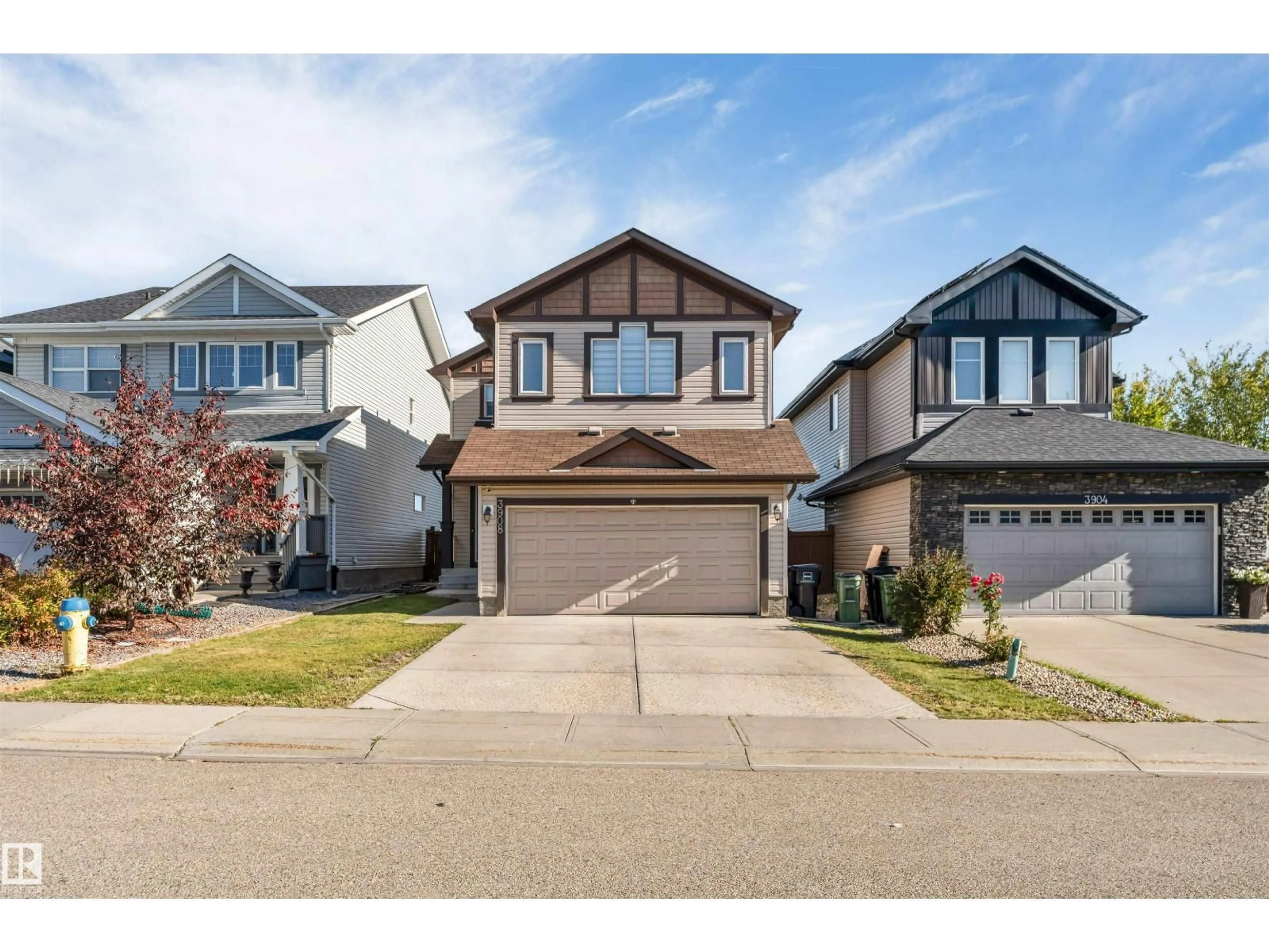 Home with vinyl exterior material, street for 3908 166 AV, Edmonton Alberta T5Y0N9