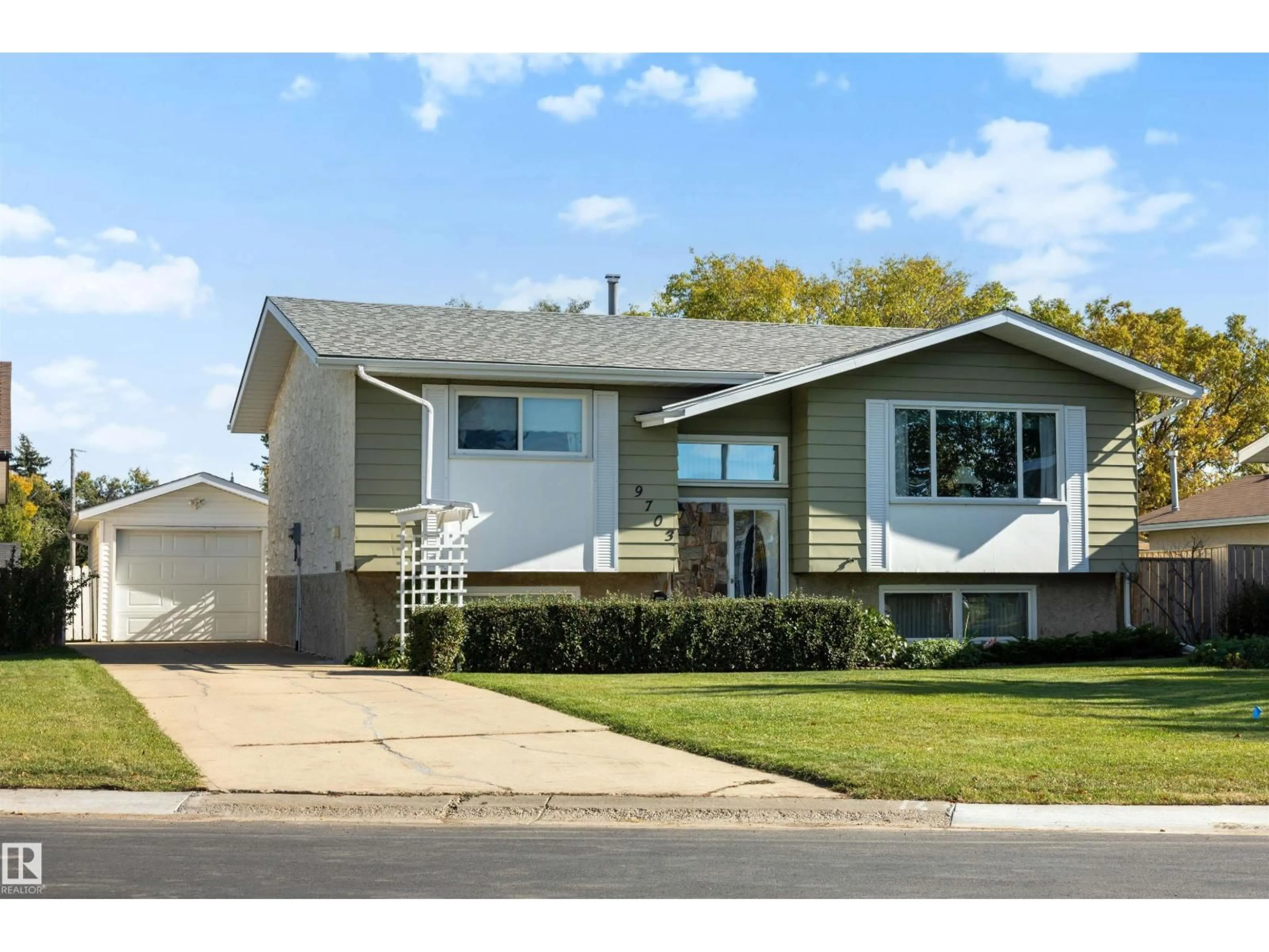 Home with vinyl exterior material, street for 9703 104 ST, Morinville Alberta T8R1C9