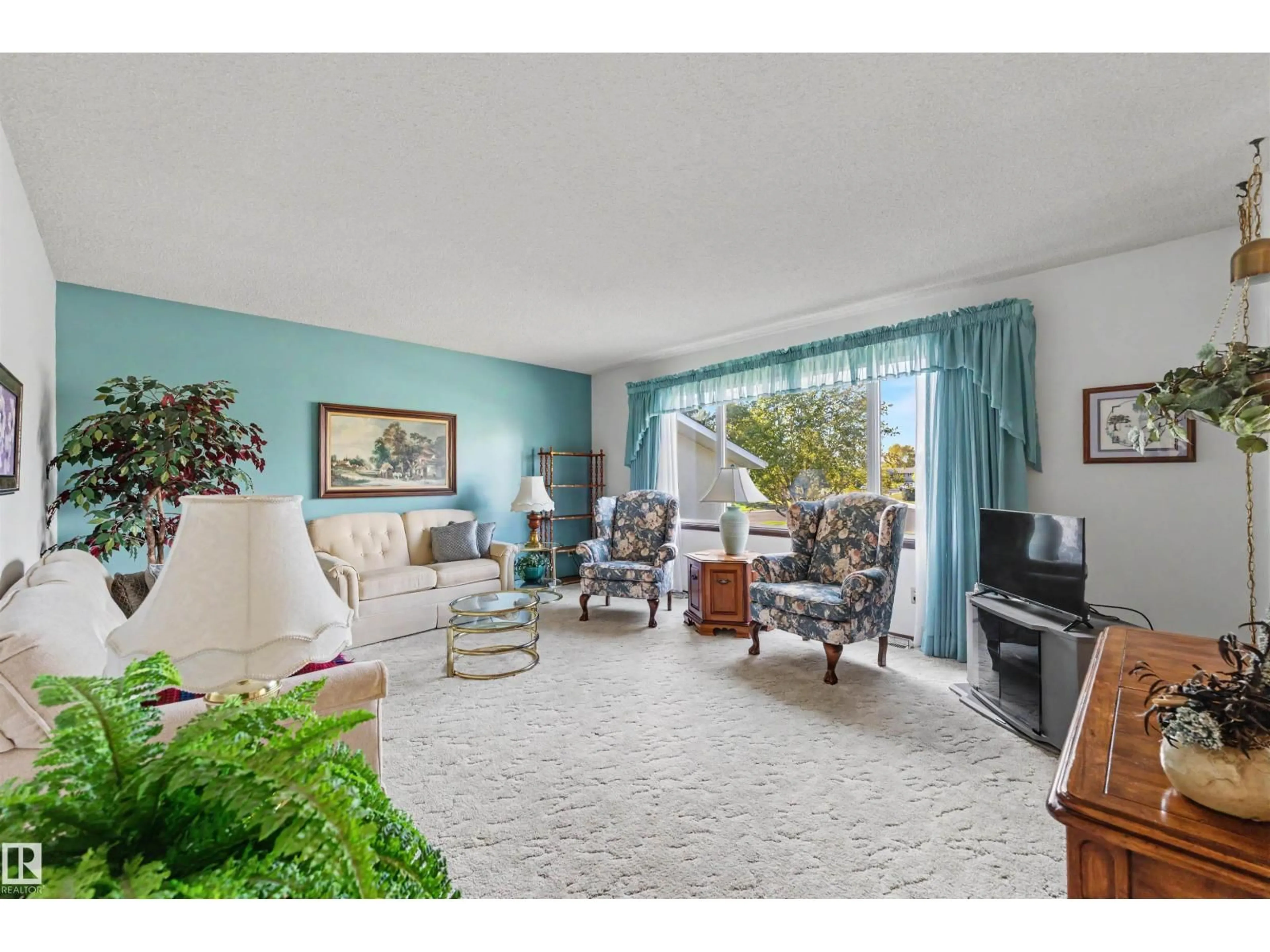Living room with furniture, unknown for 9703 104 ST, Morinville Alberta T8R1C9