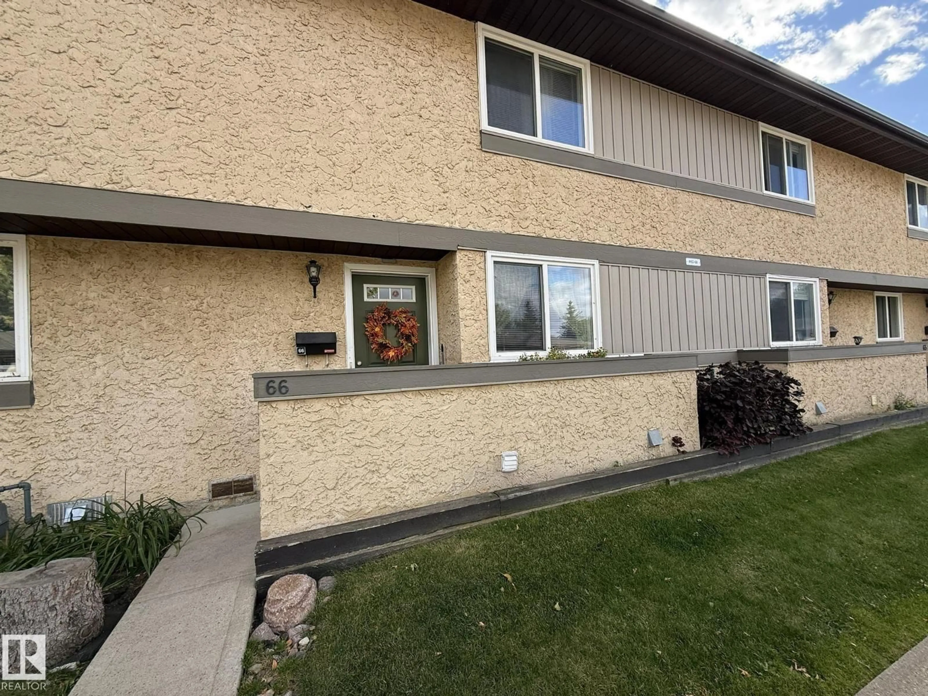 Home with vinyl exterior material, street for 66 - 8930 99 AV, Fort Saskatchewan Alberta T8L3L1