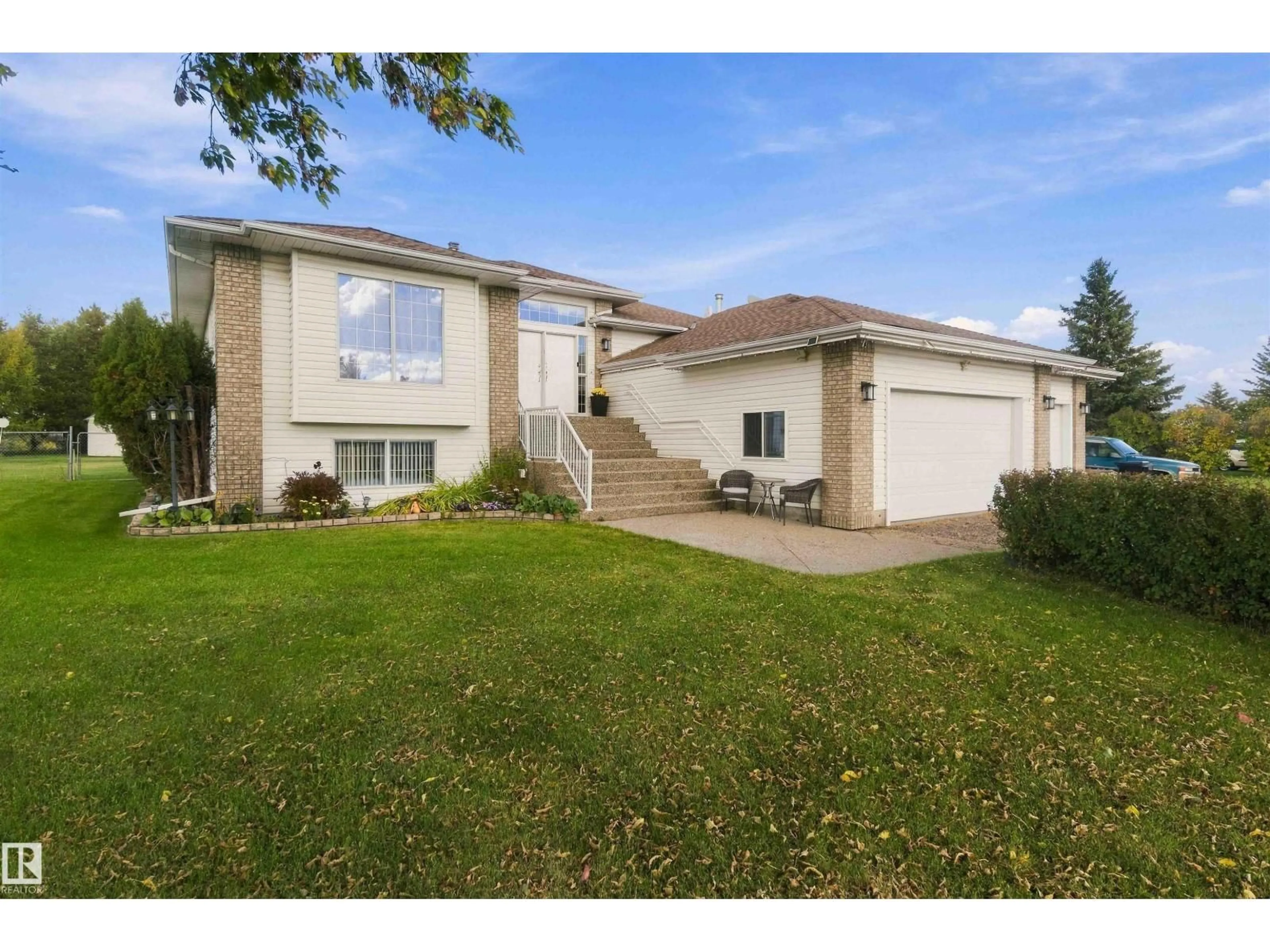 Home with vinyl exterior material, street for 16 RGE RD 230, Rural Sturgeon County Alberta T0A1N2