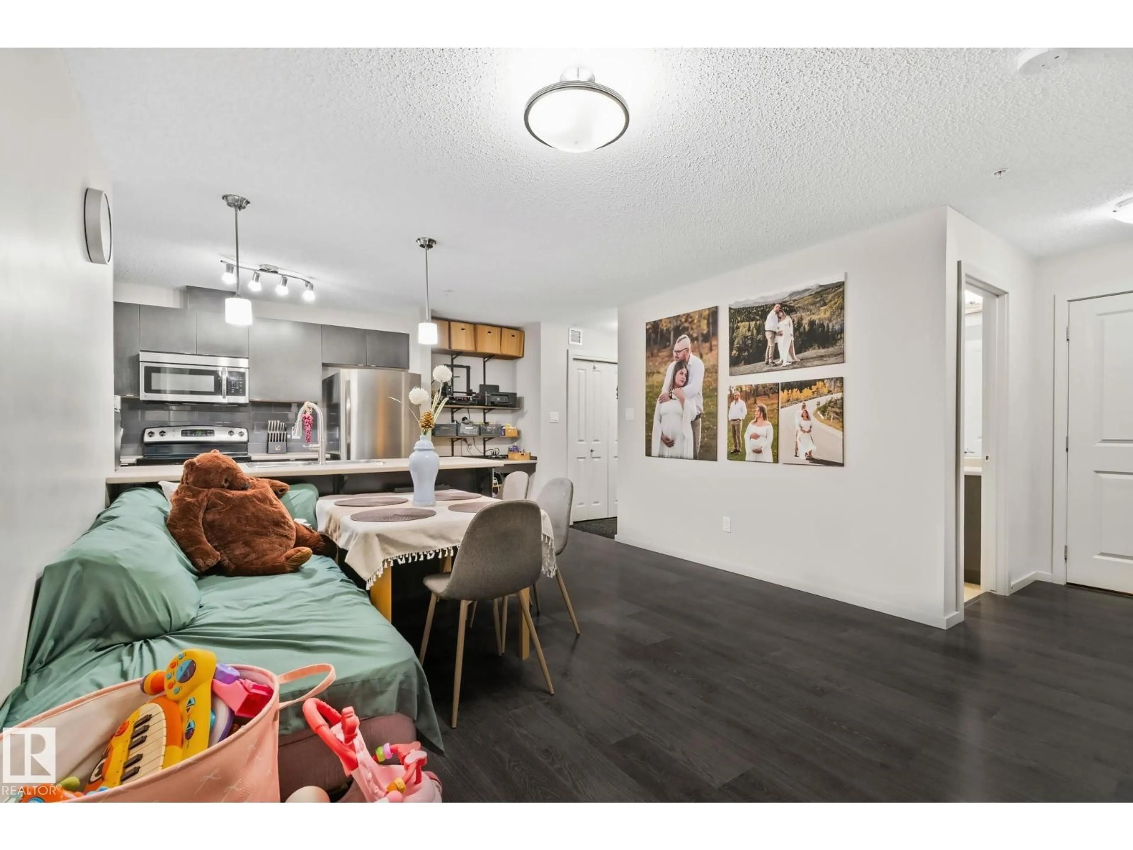 Open concept kitchen, wood/laminate floor for 344 - 226 WINDERMERE RD NW, Edmonton Alberta T6W2P2