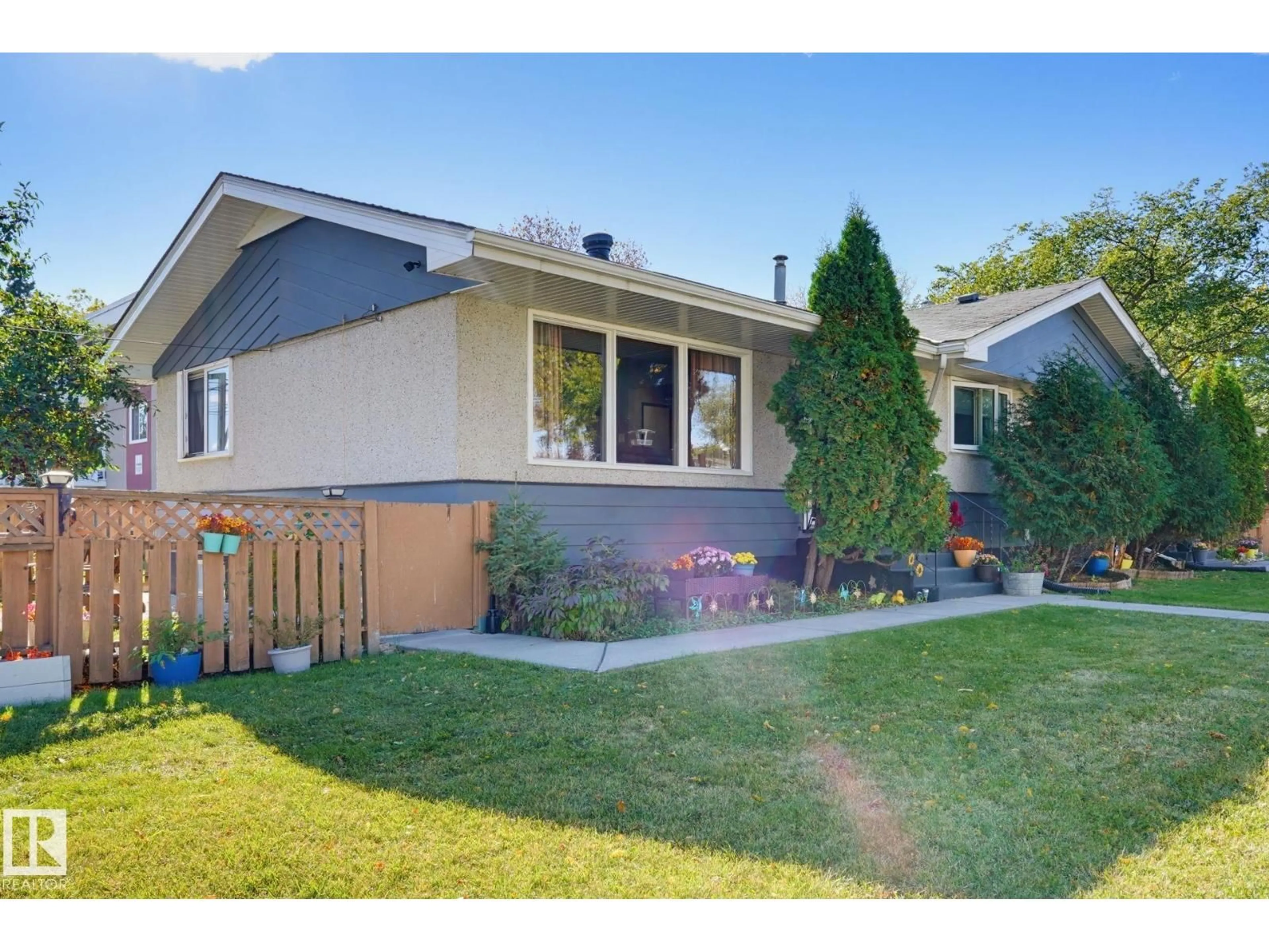 Home with vinyl exterior material, street for NW - 10207 & 10209 120 AV, Edmonton Alberta T5G0S3