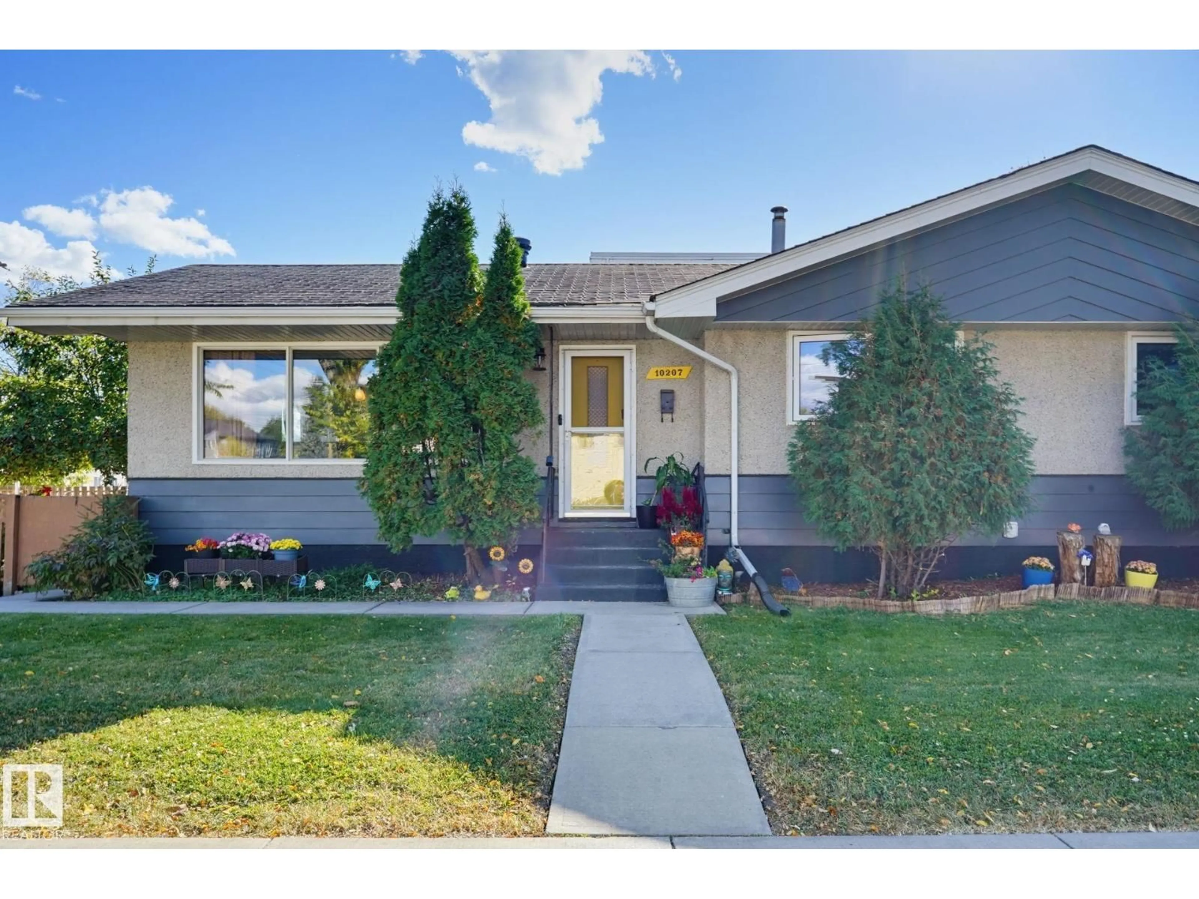 Home with vinyl exterior material, street for NW - 10207 & 10209 120 AV, Edmonton Alberta T5G0S3