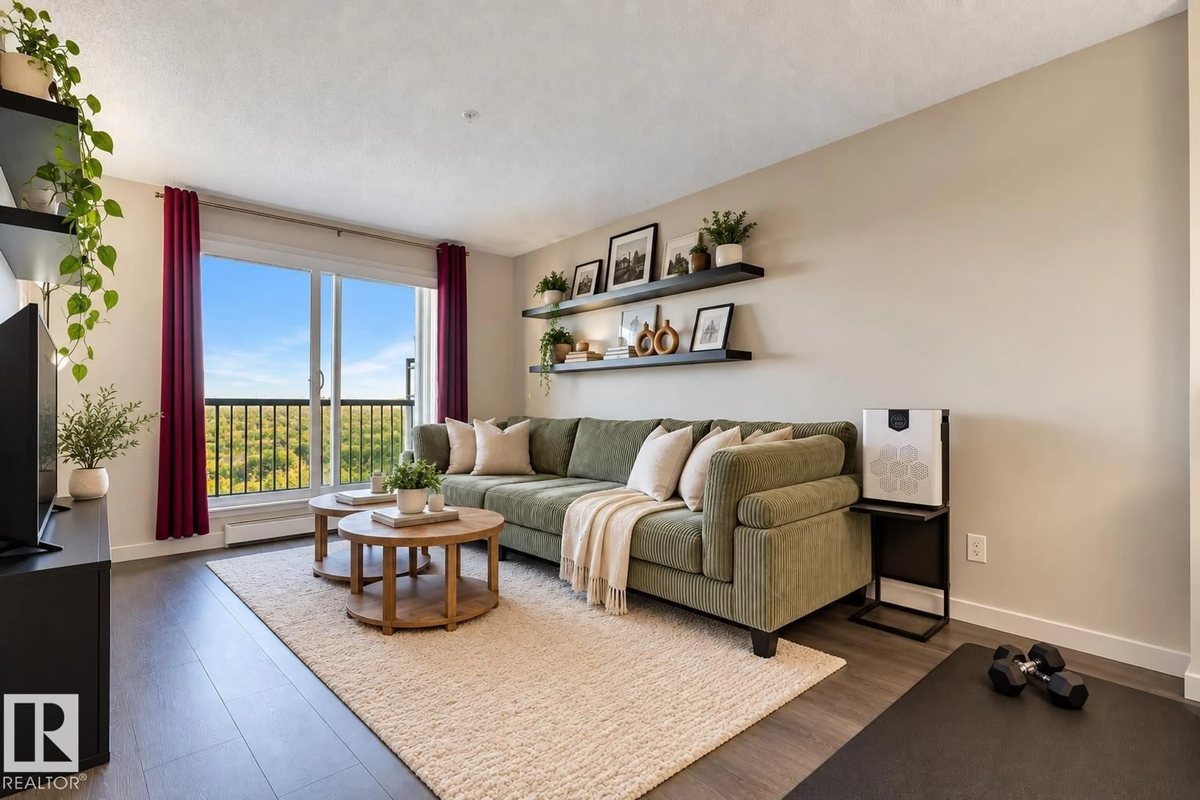 Living room with furniture, wood/laminate floor for 251 - 1196 HYNDMAN RD, Edmonton Alberta T5A0X8