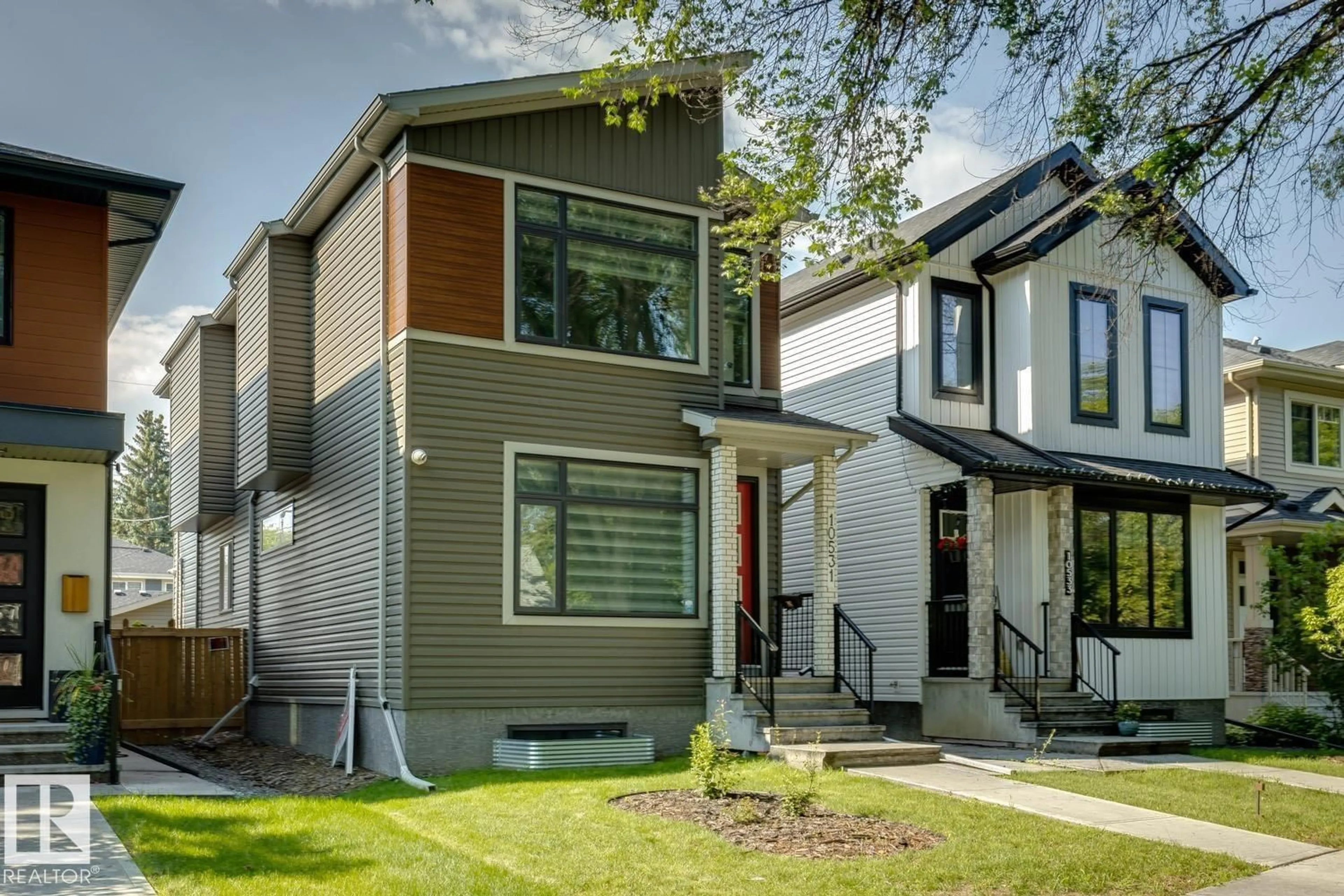 Home with vinyl exterior material, street for 10531 67 AV, Edmonton Alberta T6H1Z4