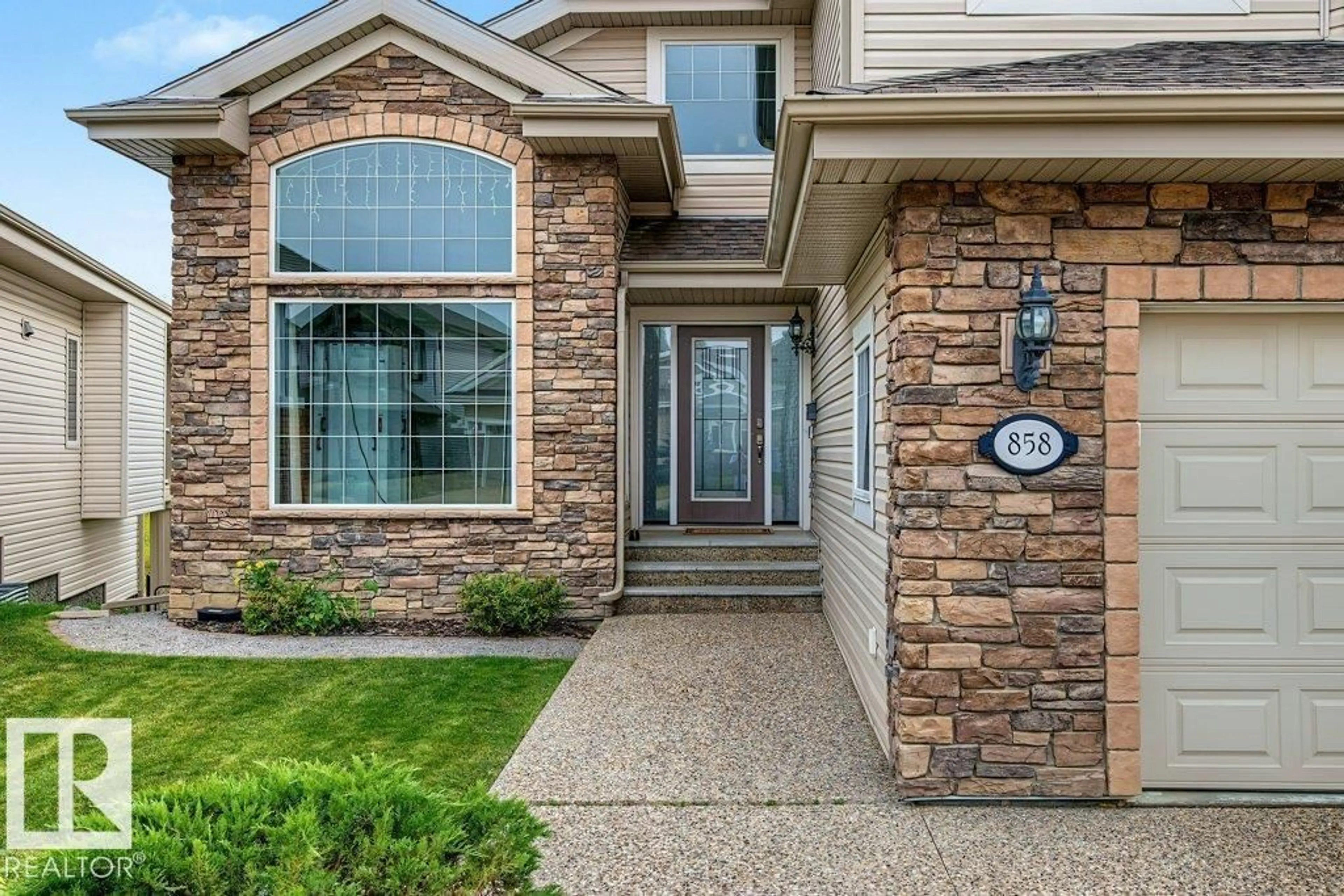 Home with brick exterior material, street for 858 HODGINS RD, Edmonton Alberta T6M0K8