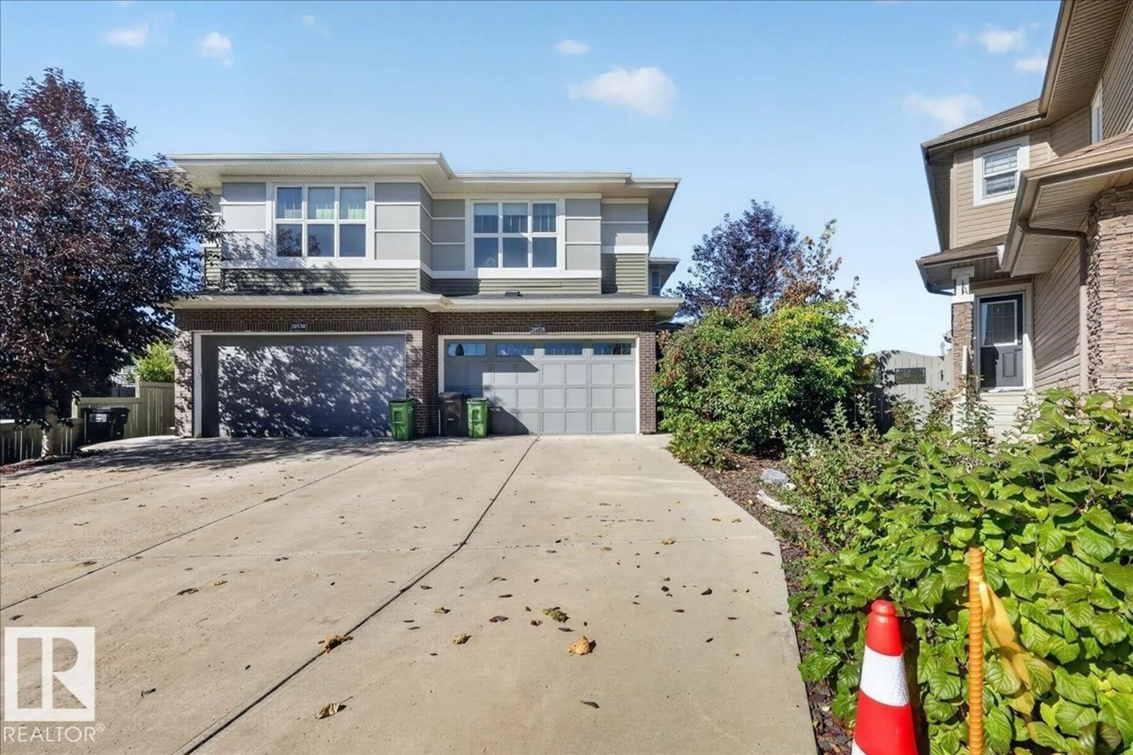 Home with vinyl exterior material, street for 20528 128 AV, Edmonton Alberta T5S0L8