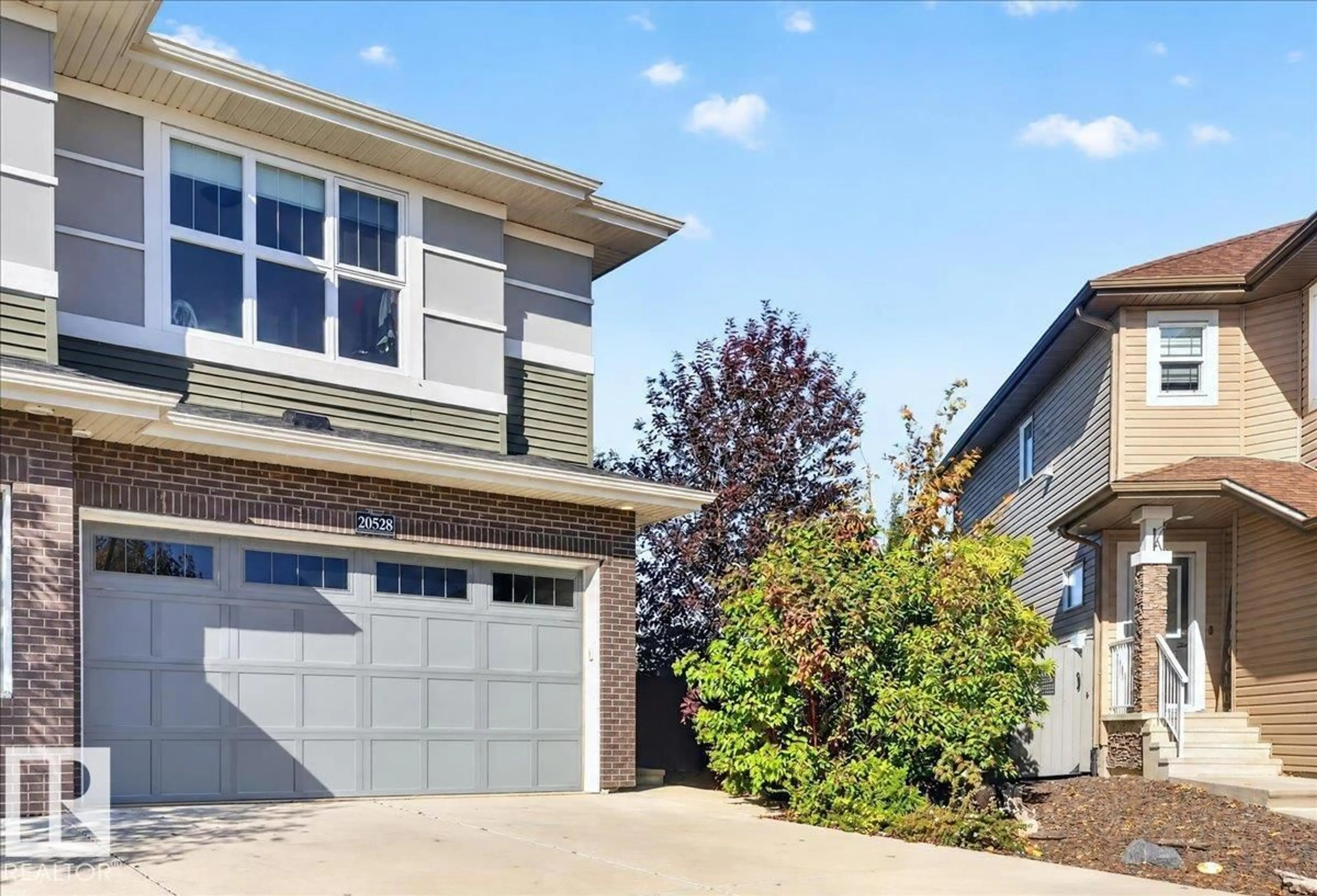 Home with vinyl exterior material, street for 20528 128 AV, Edmonton Alberta T5S0L8