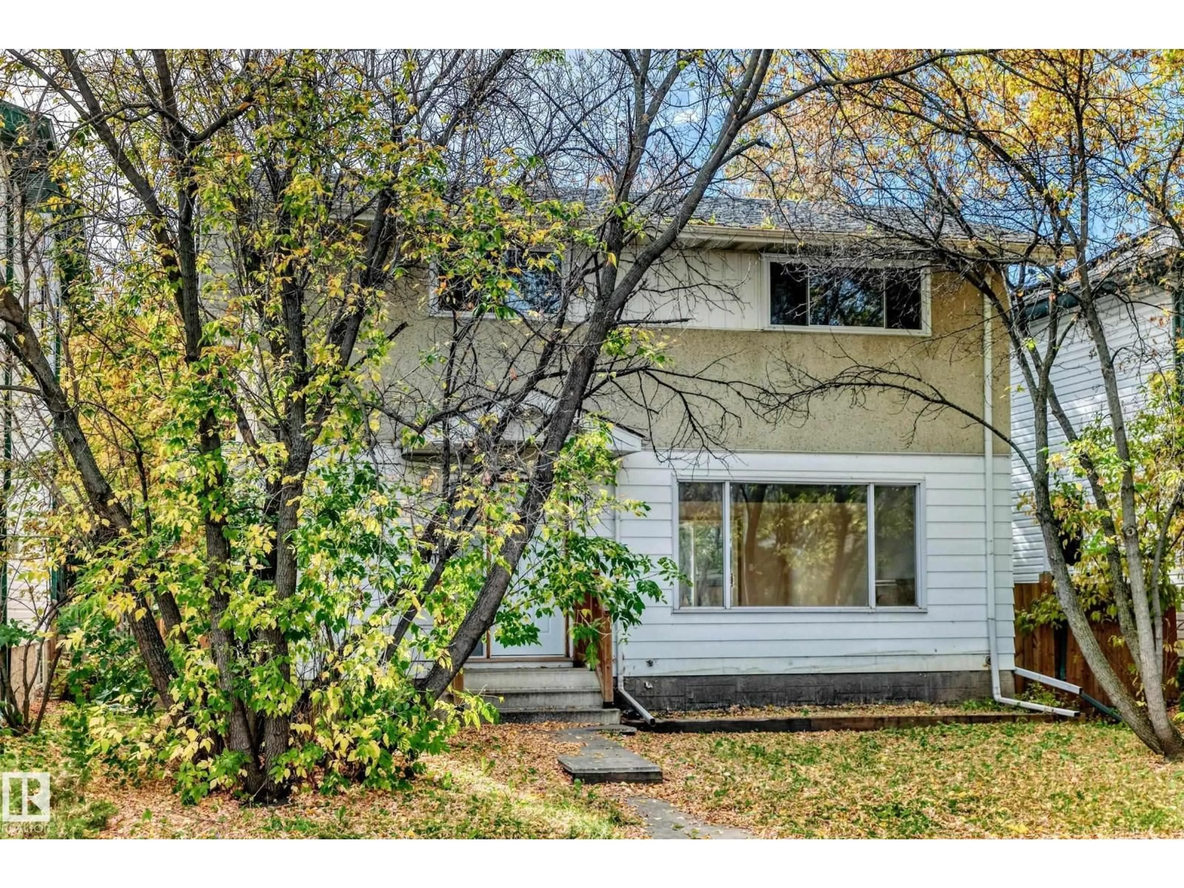 Home with vinyl exterior material, street for 10919 69 AV, Edmonton Alberta T6H2E4