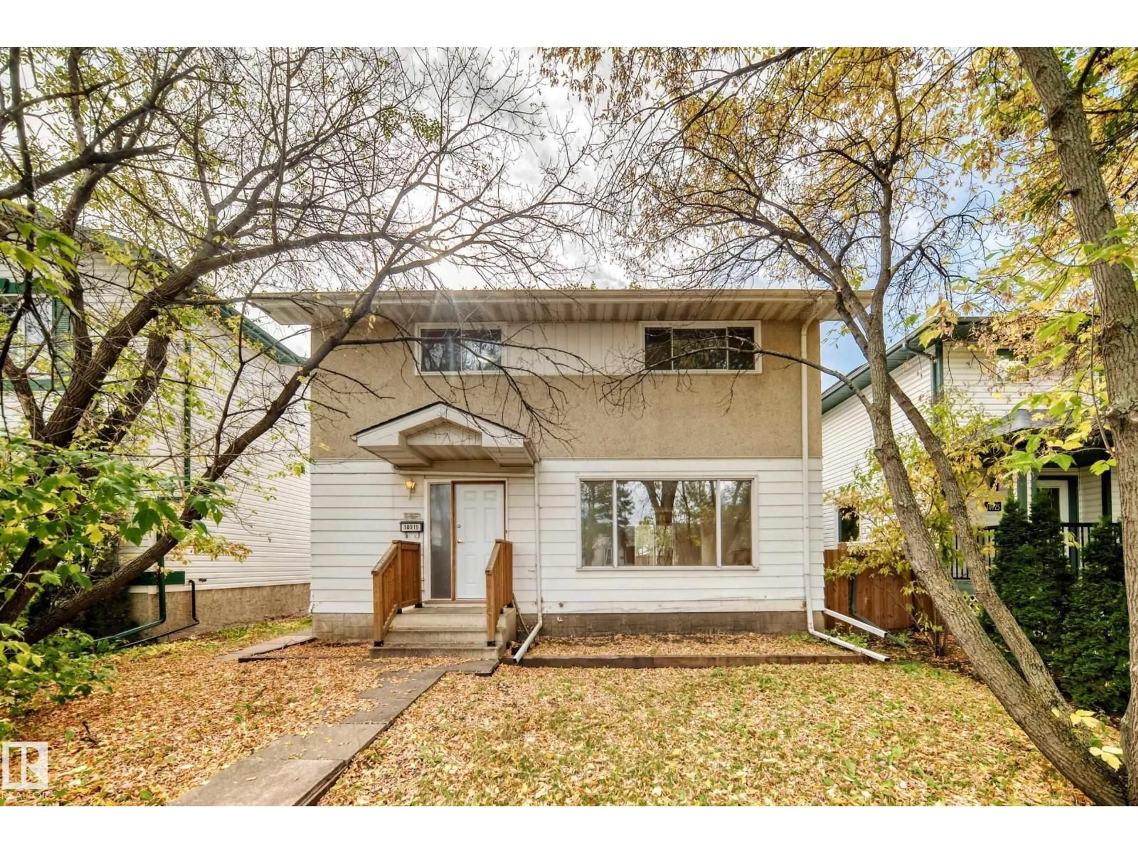 Home with vinyl exterior material, street for 10919 69 AV, Edmonton Alberta T6H2E4
