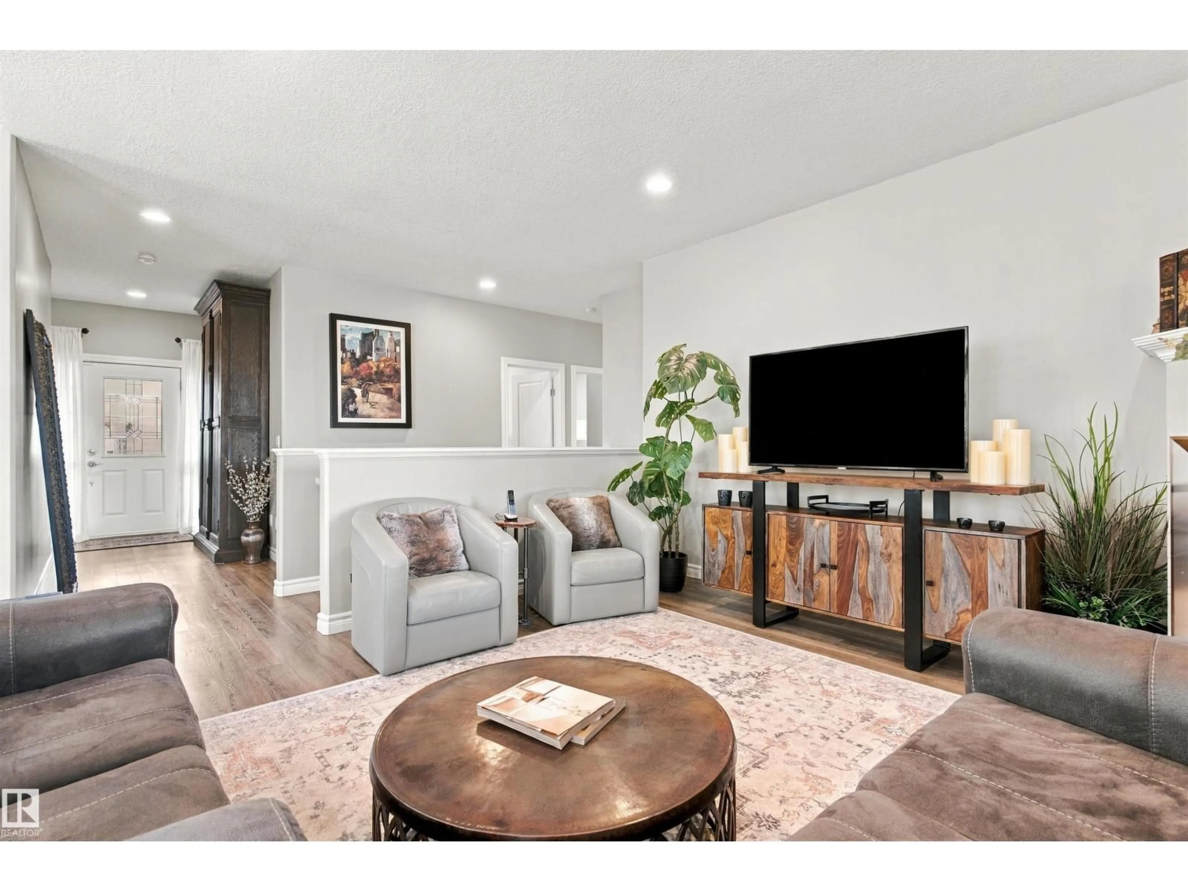 Living room with furniture, wood/laminate floor for 3611 61 ST, Beaumont Alberta T4X1T5