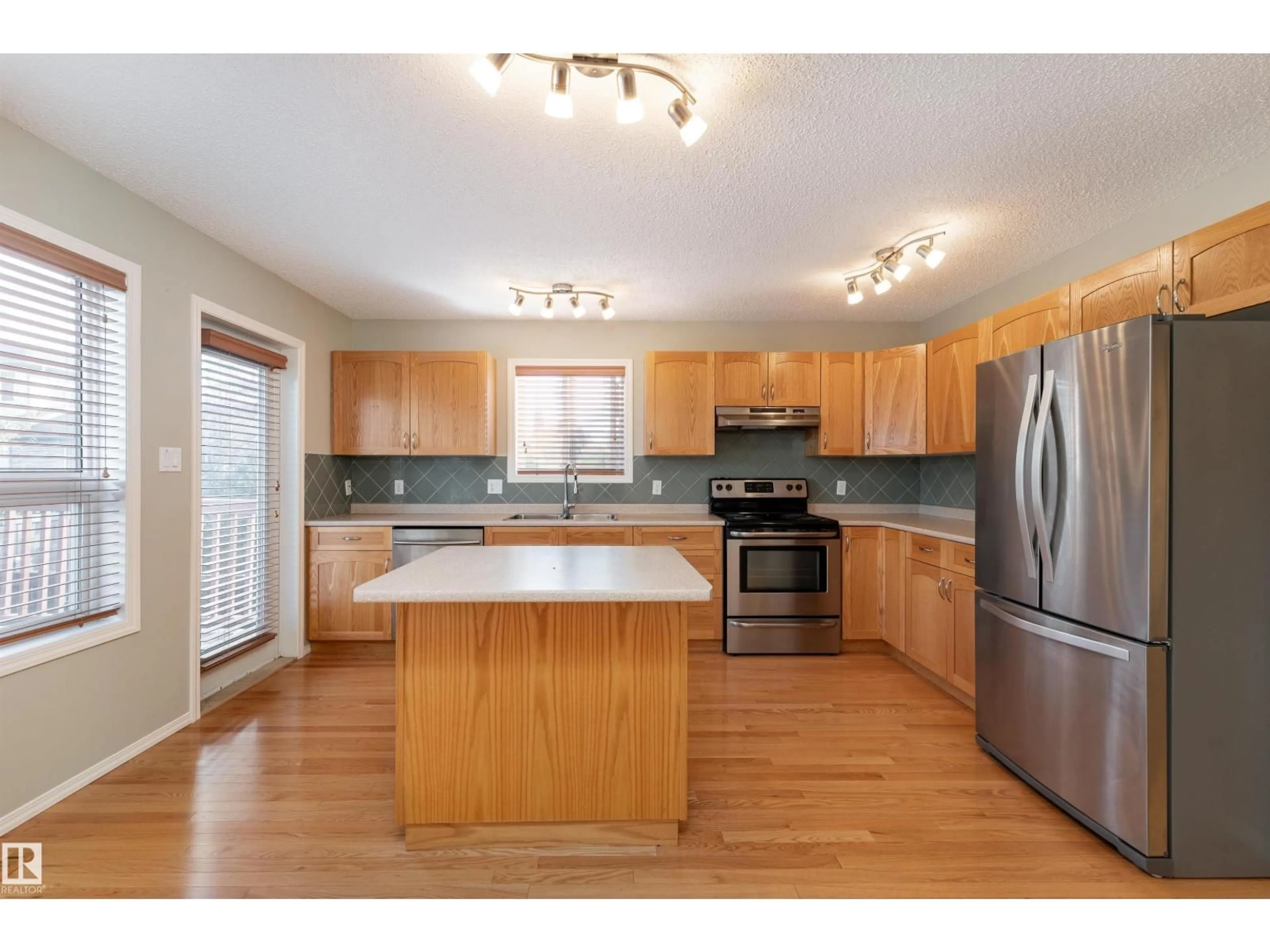 Open concept kitchen, wood/laminate floor for SW - 812 BARNES LINK LI, Edmonton Alberta T6W1E8