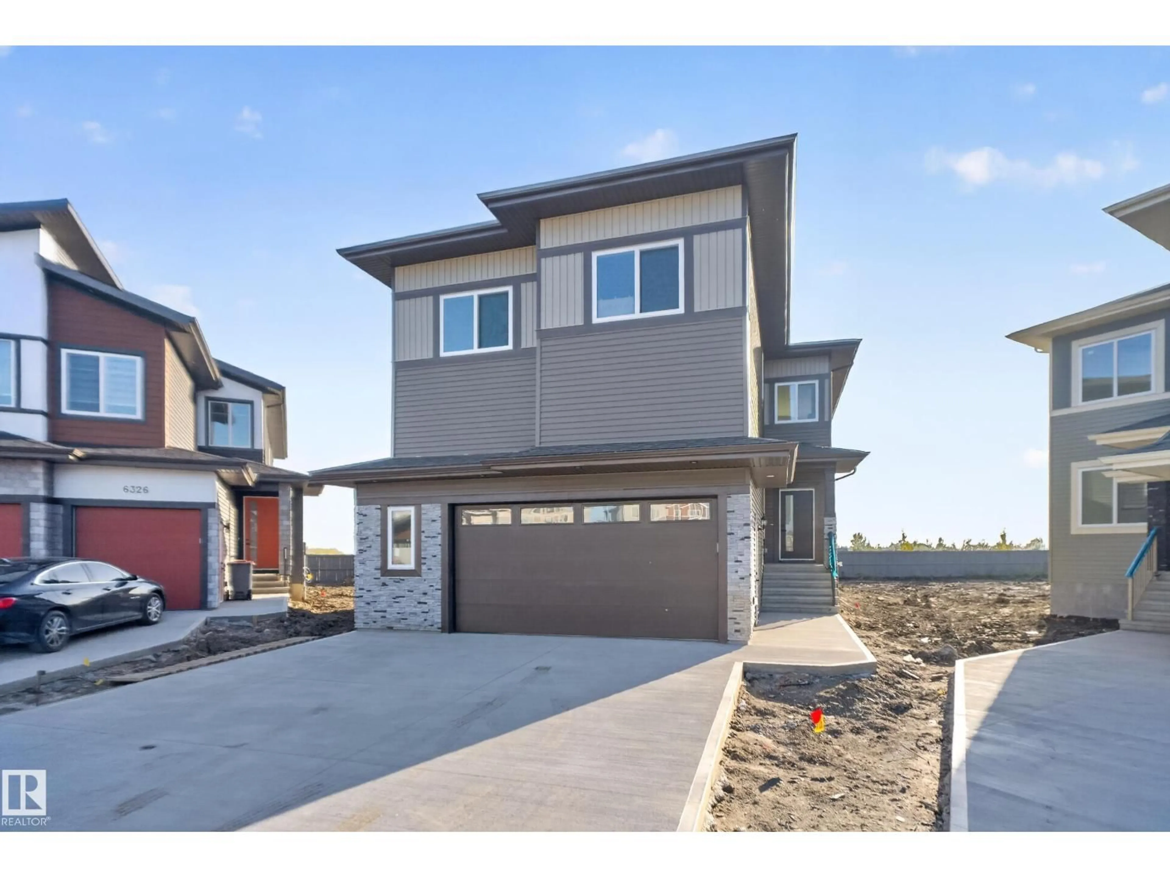 Home with vinyl exterior material, street for NE - 6320 24 ST, Rural Leduc County Alberta T6X3A6
