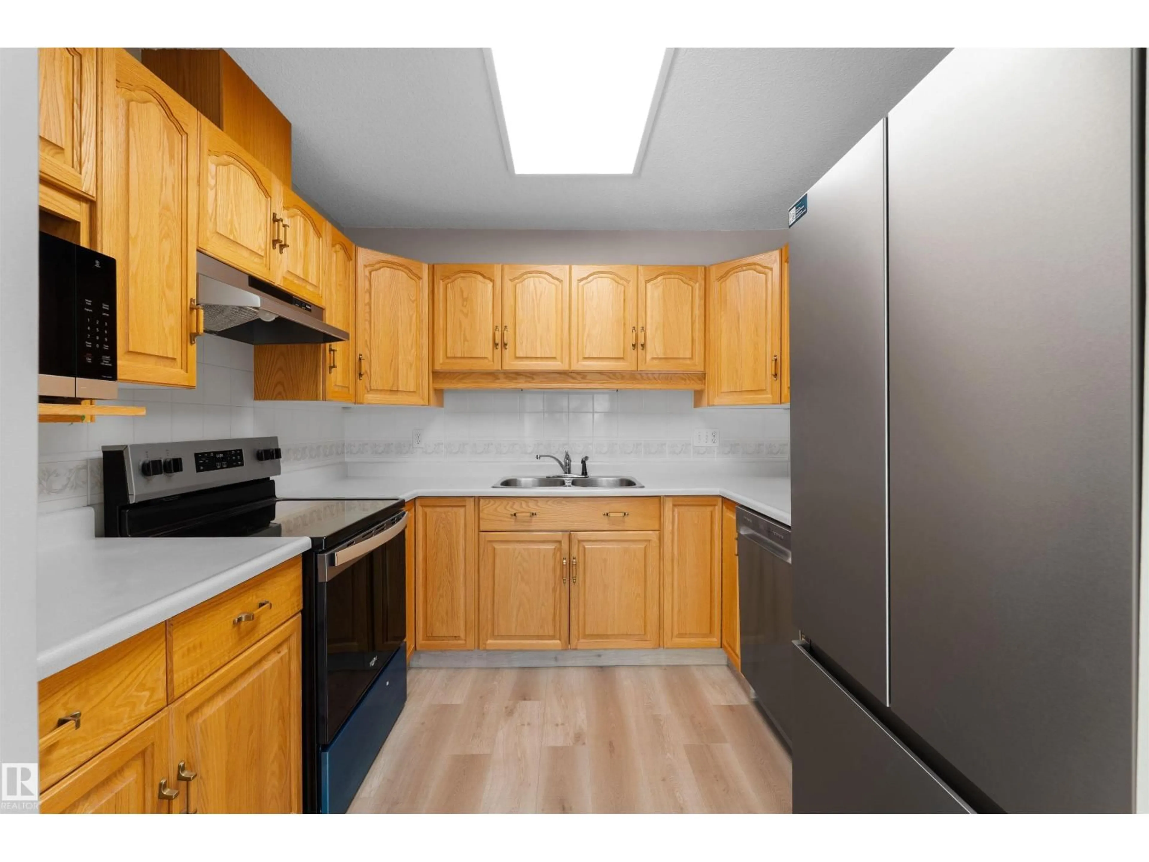 Standard kitchen, wood/laminate floor for 408 - 10610 76 ST NW, Edmonton Alberta T6A3Y9