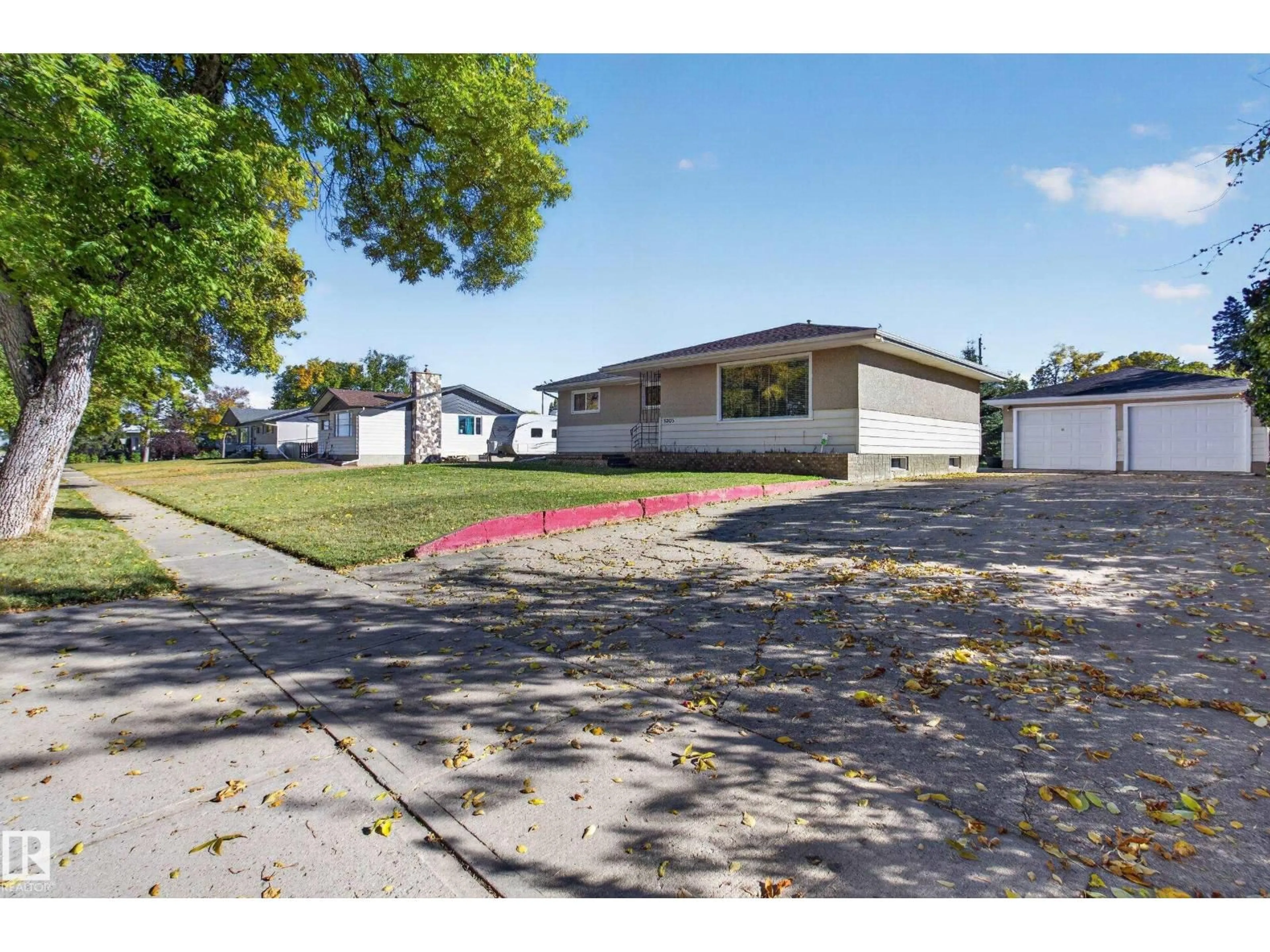 A pic from outside/outdoor area/front of a property/back of a property/a pic from drone, street for 5205 56 ST, Camrose Alberta T4V2E2