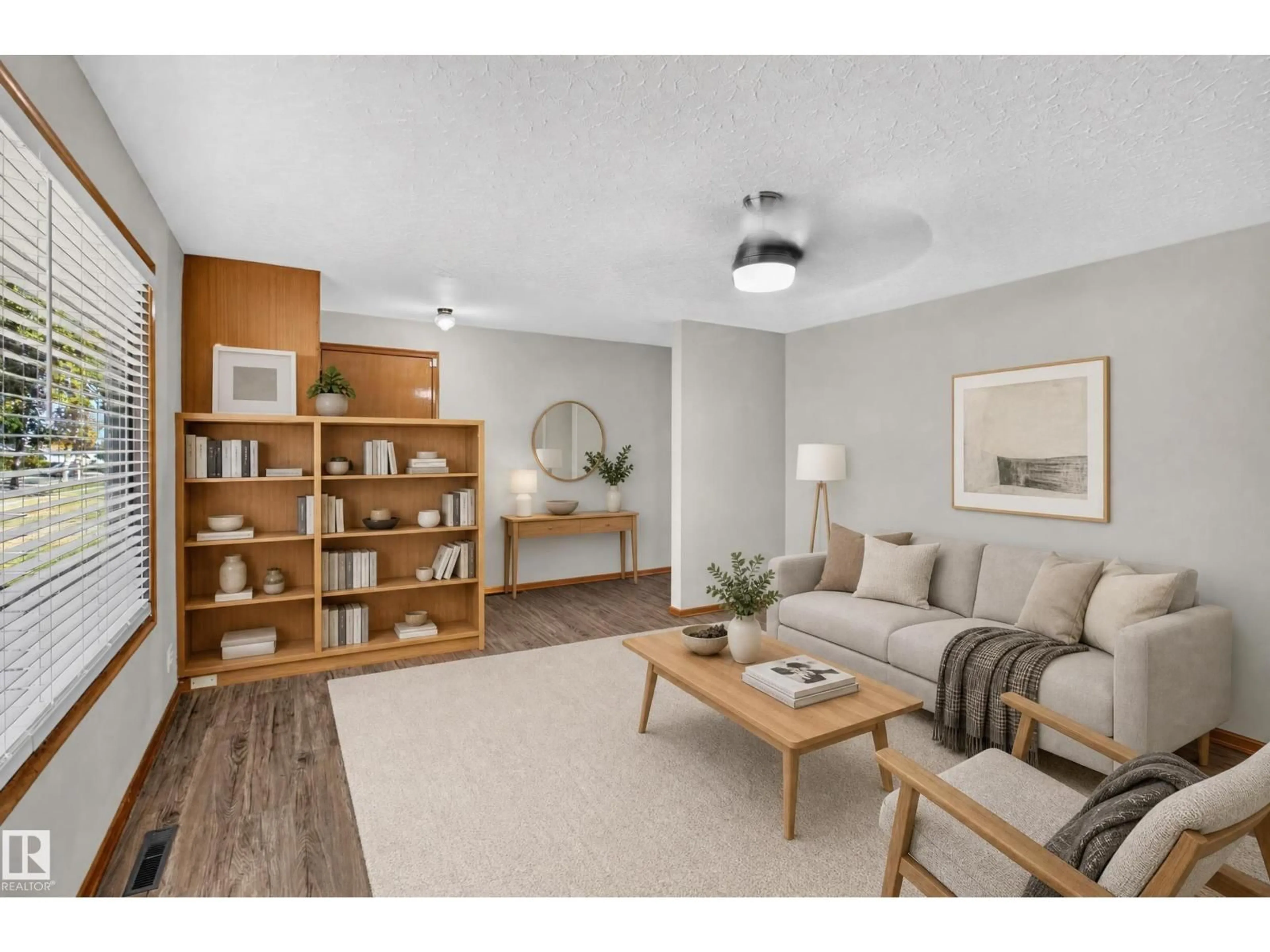 Living room with furniture, wood/laminate floor for 5205 56 ST, Camrose Alberta T4V2E2
