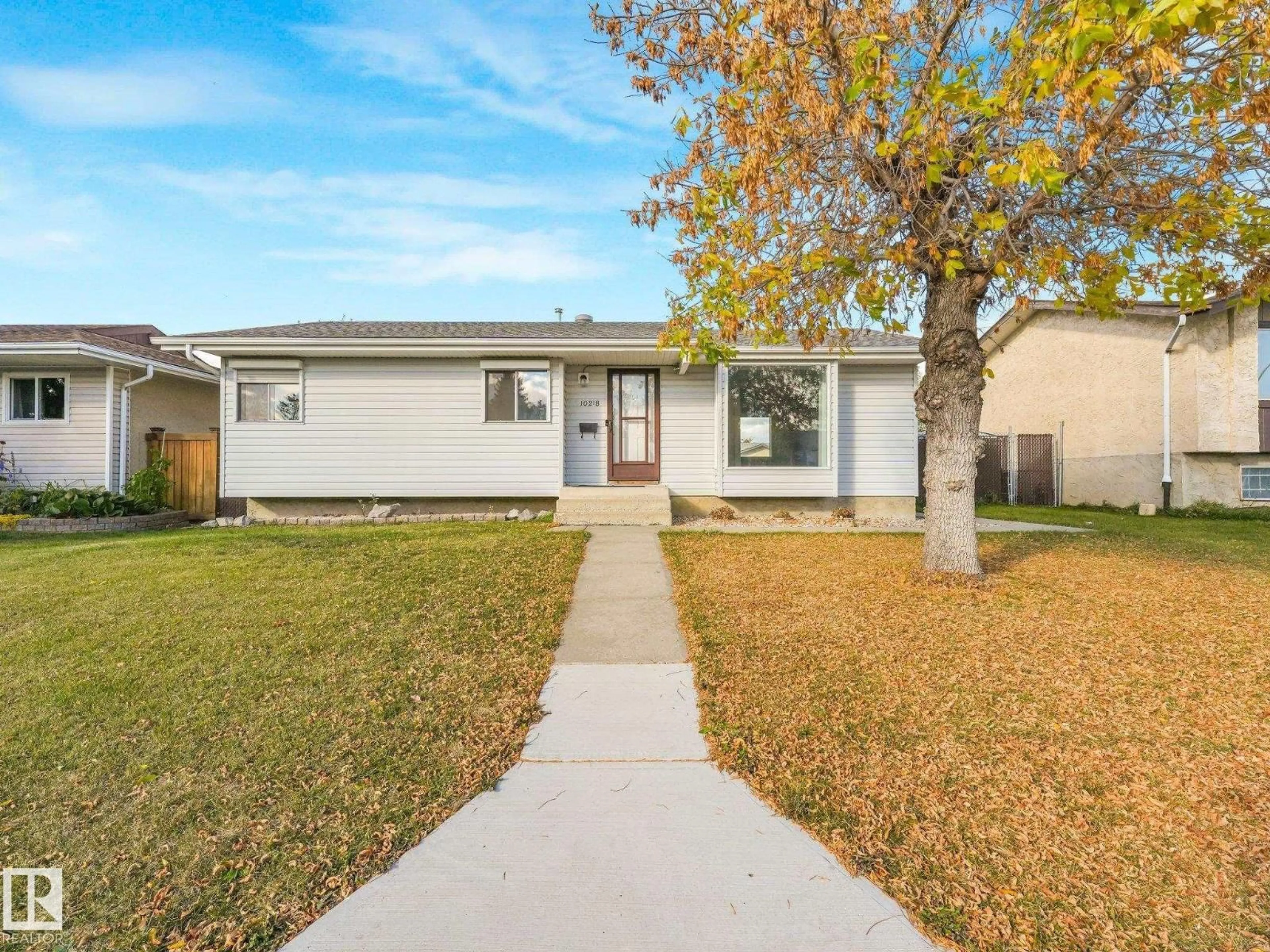 Home with vinyl exterior material, street for 10218 167A AV, Edmonton Alberta T5X2Z3