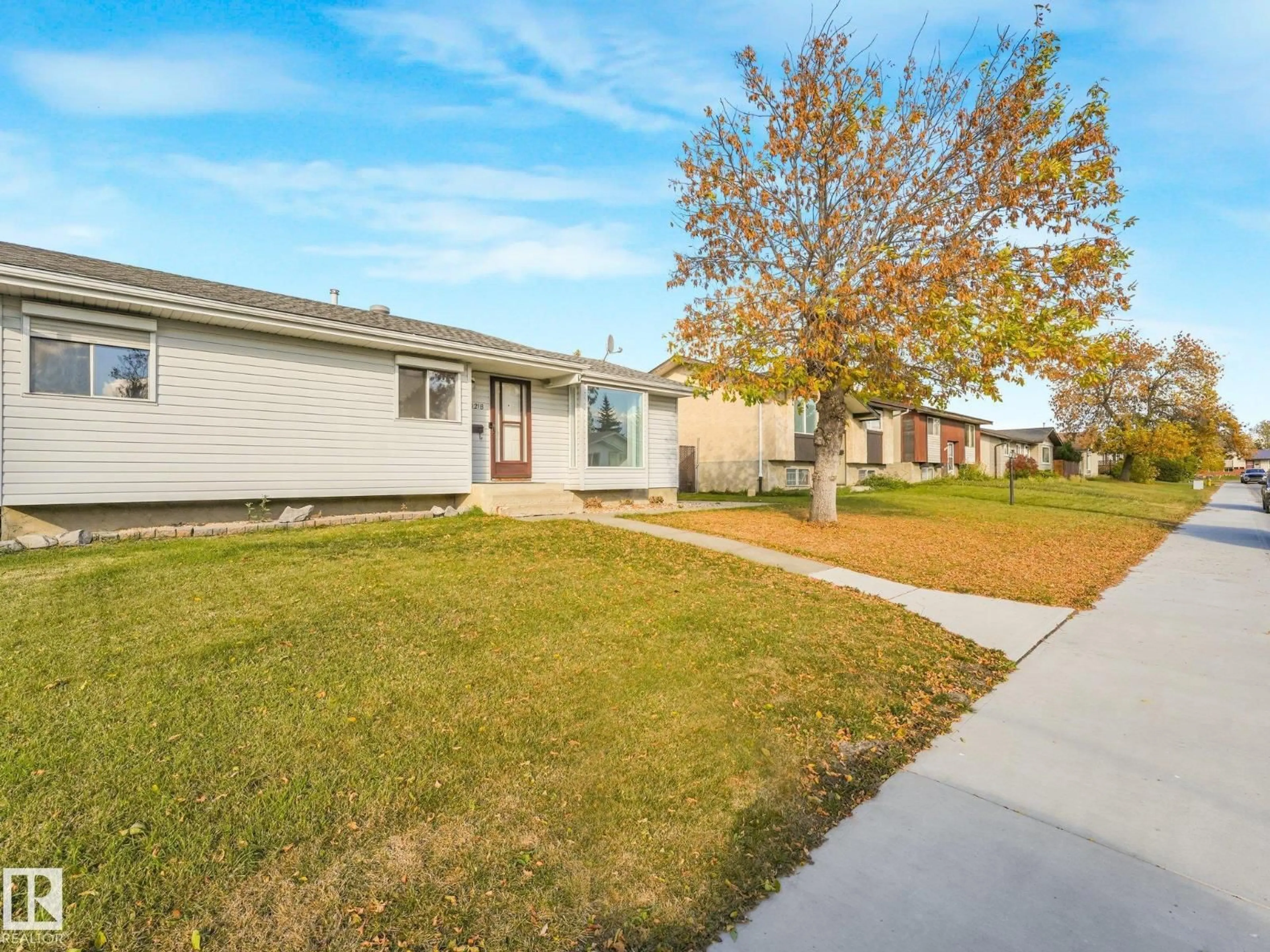 Home with vinyl exterior material, street for 10218 167A AV, Edmonton Alberta T5X2Z3