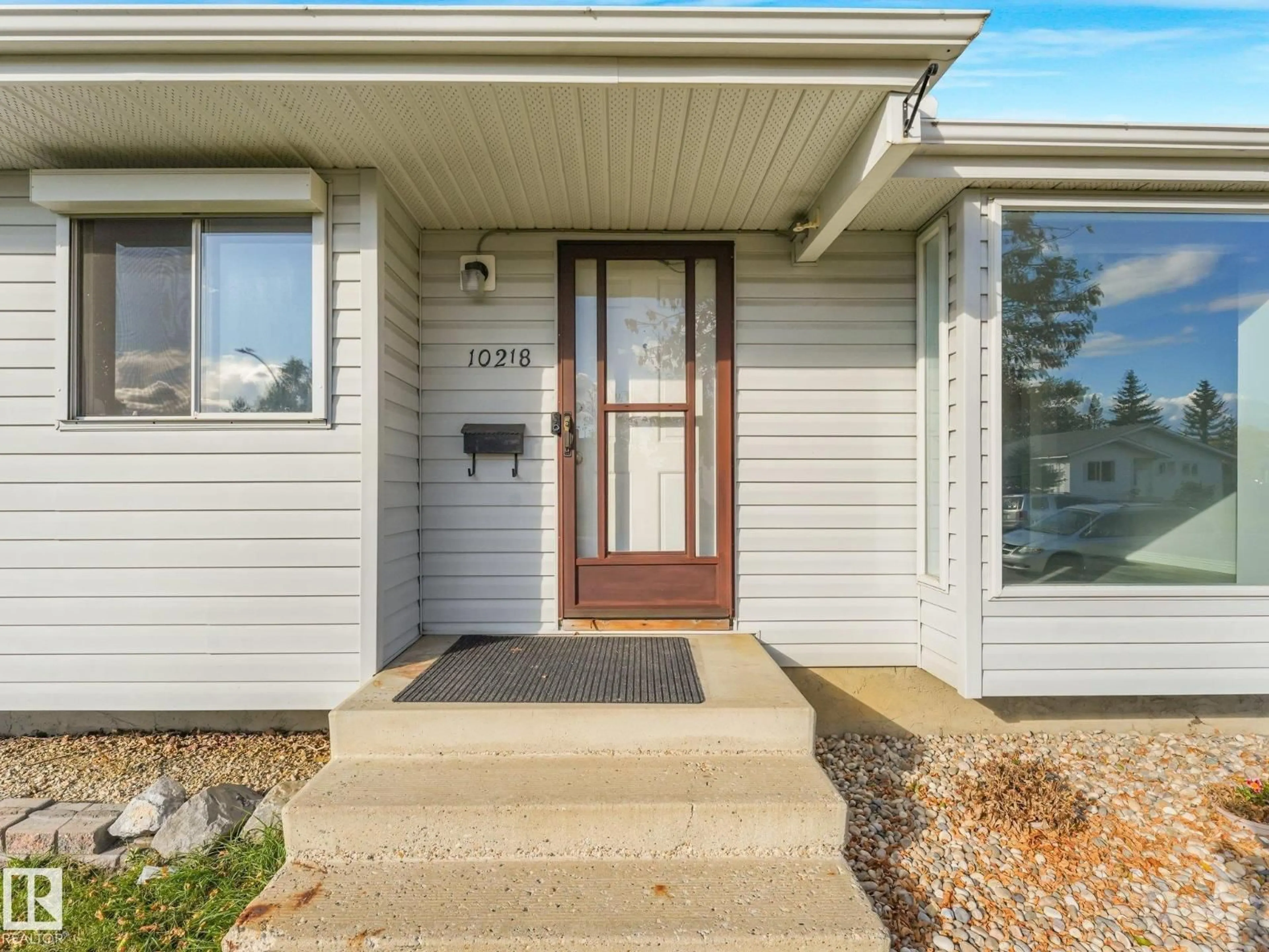 Home with vinyl exterior material, street for 10218 167A AV, Edmonton Alberta T5X2Z3