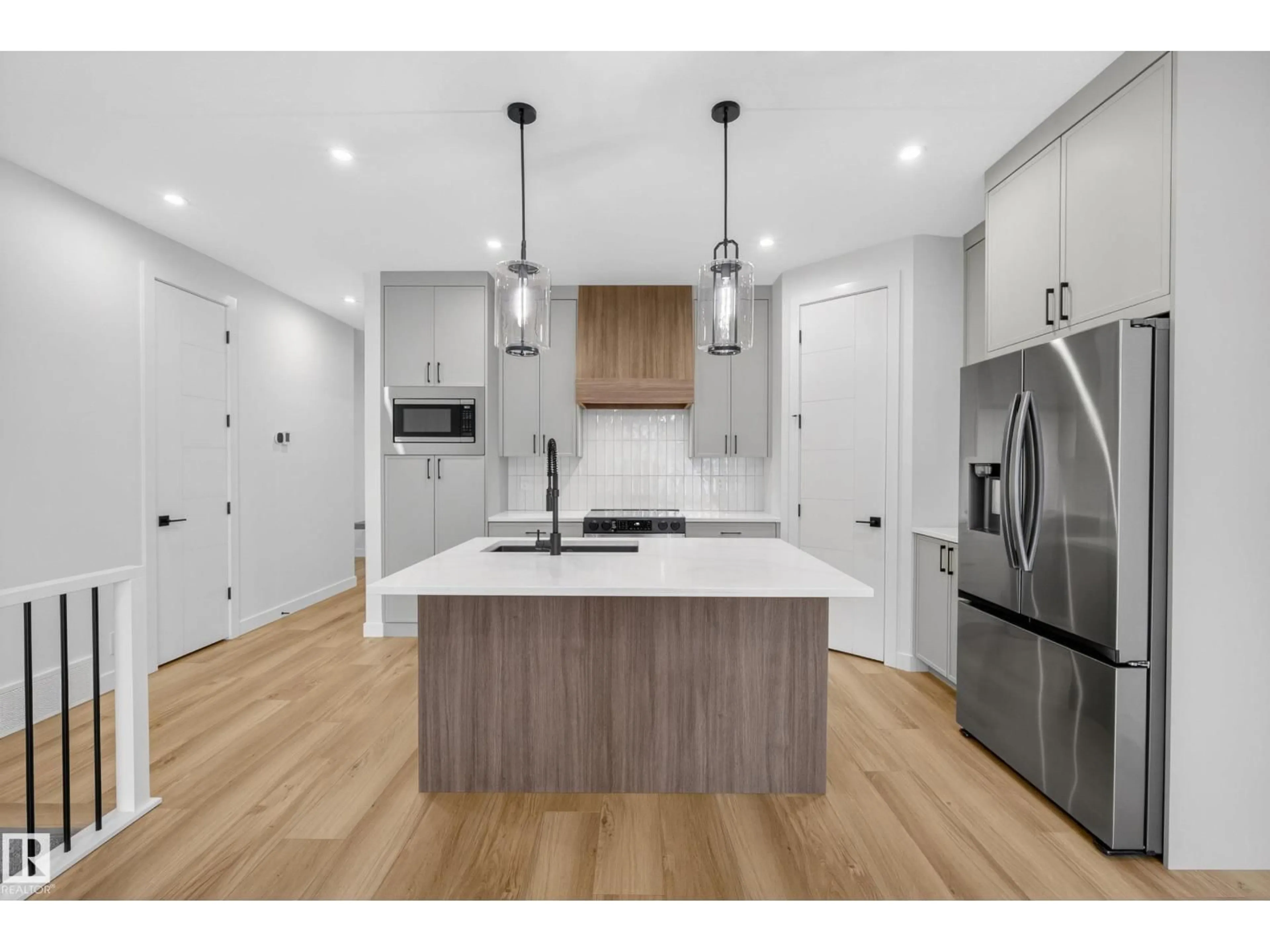 Open concept kitchen, wood/laminate floor for 99 NEWBURY CI, Sherwood Park Alberta T8B0E8