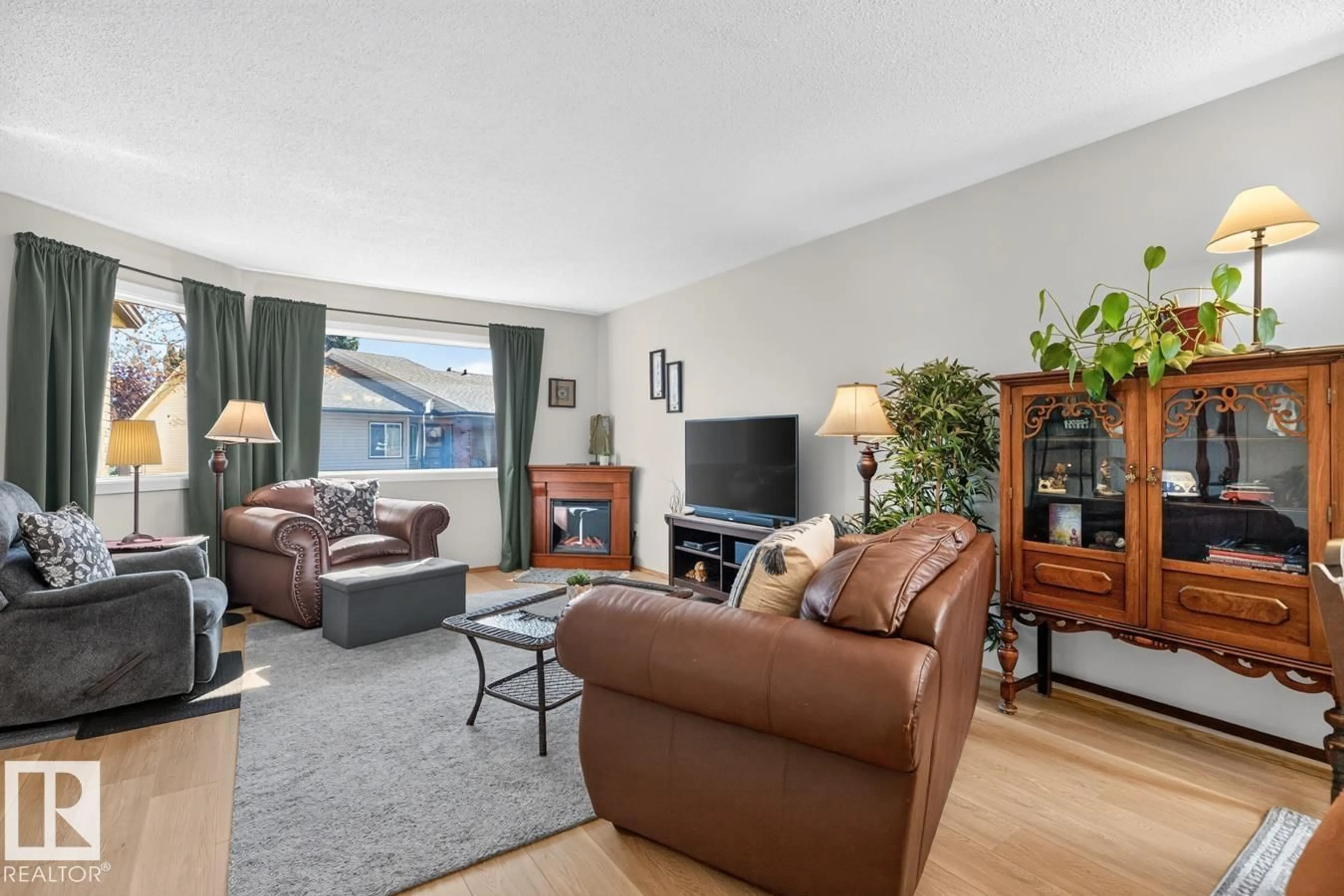 Living room with furniture, unknown for 10860 11 AV, Edmonton Alberta T6J6H8