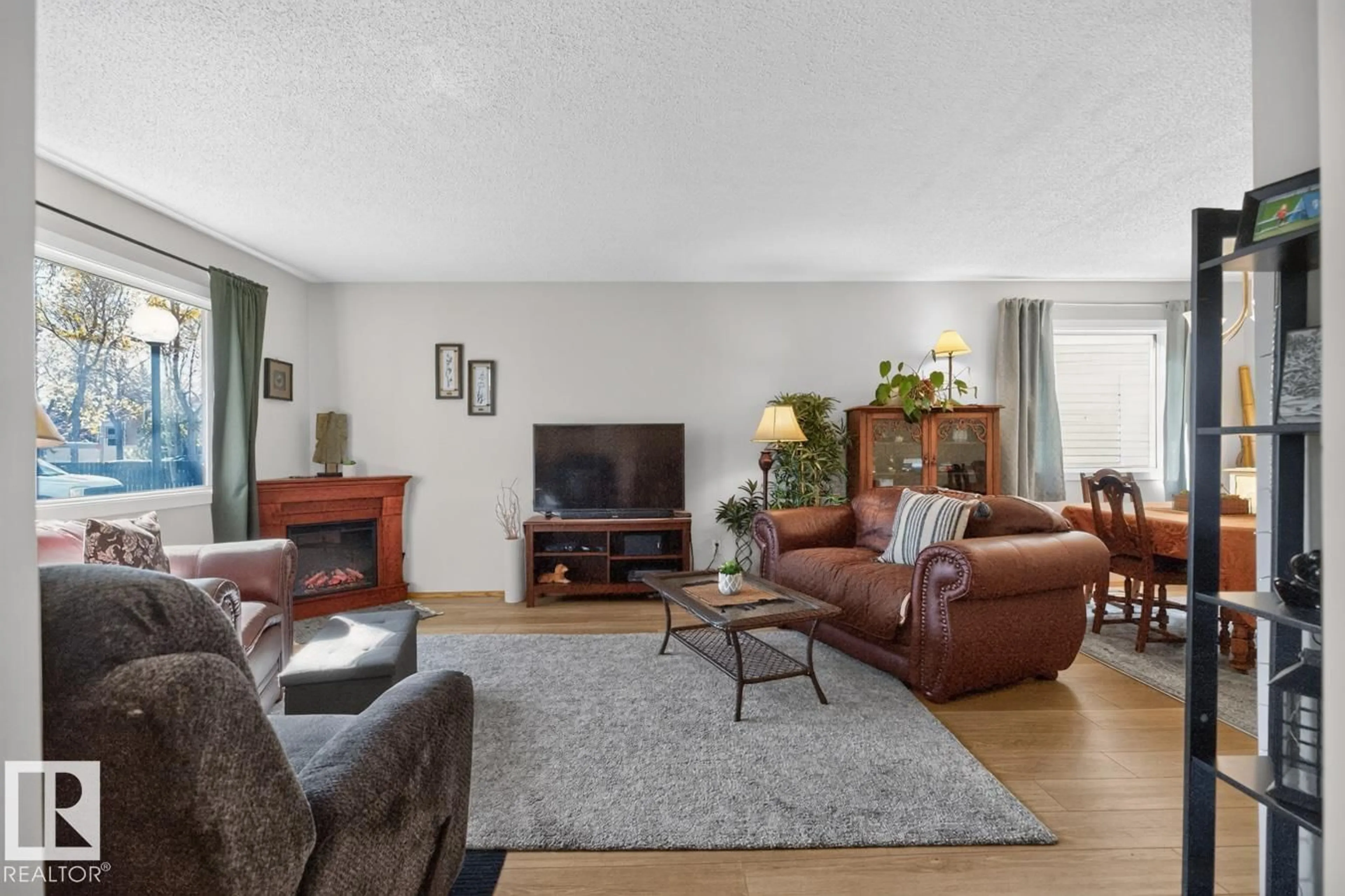 Living room with furniture, unknown for 10860 11 AV, Edmonton Alberta T6J6H8