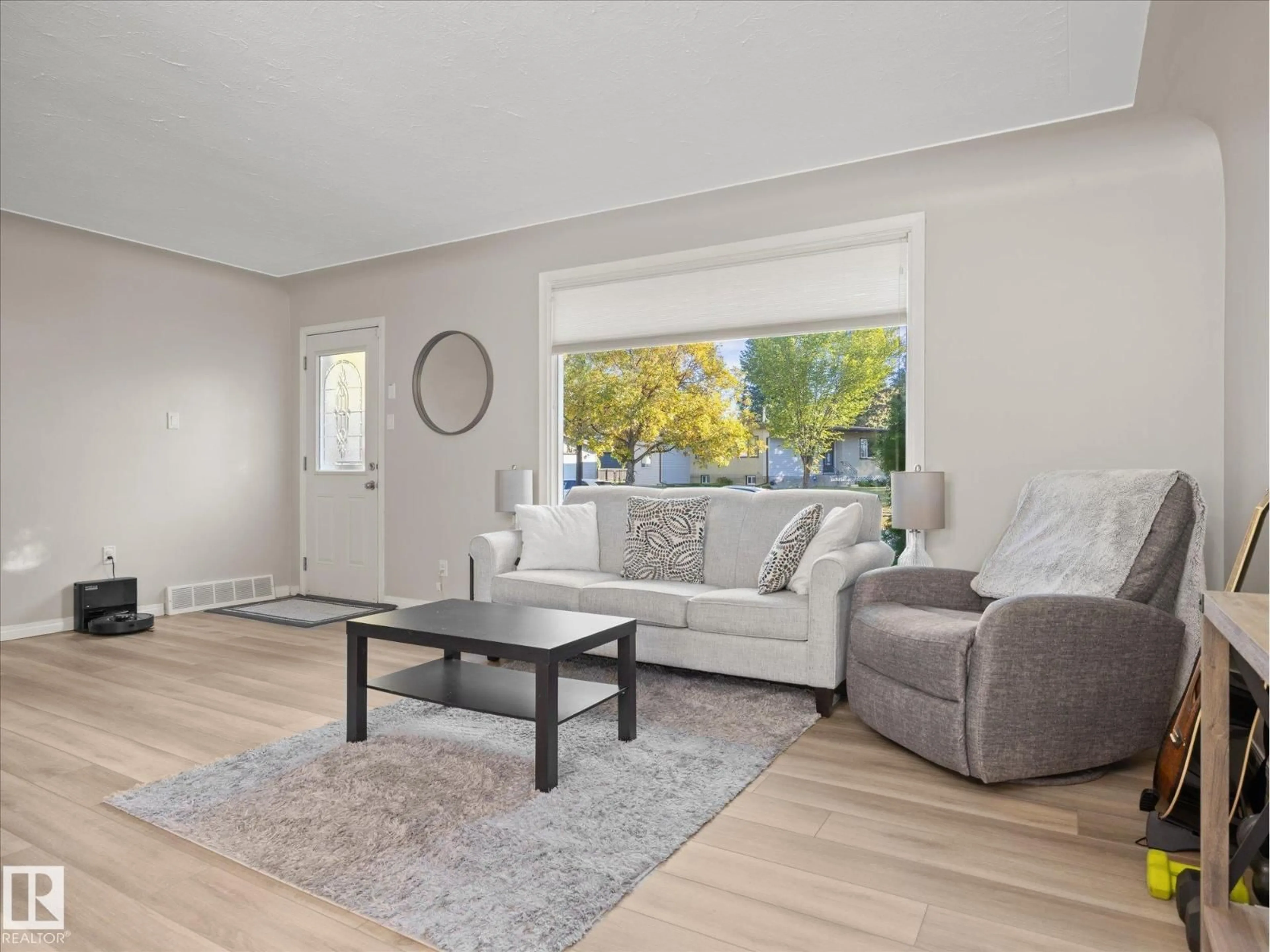 Living room with furniture, wood/laminate floor for NW - 12408 134 ST, Edmonton Alberta T5L1V2
