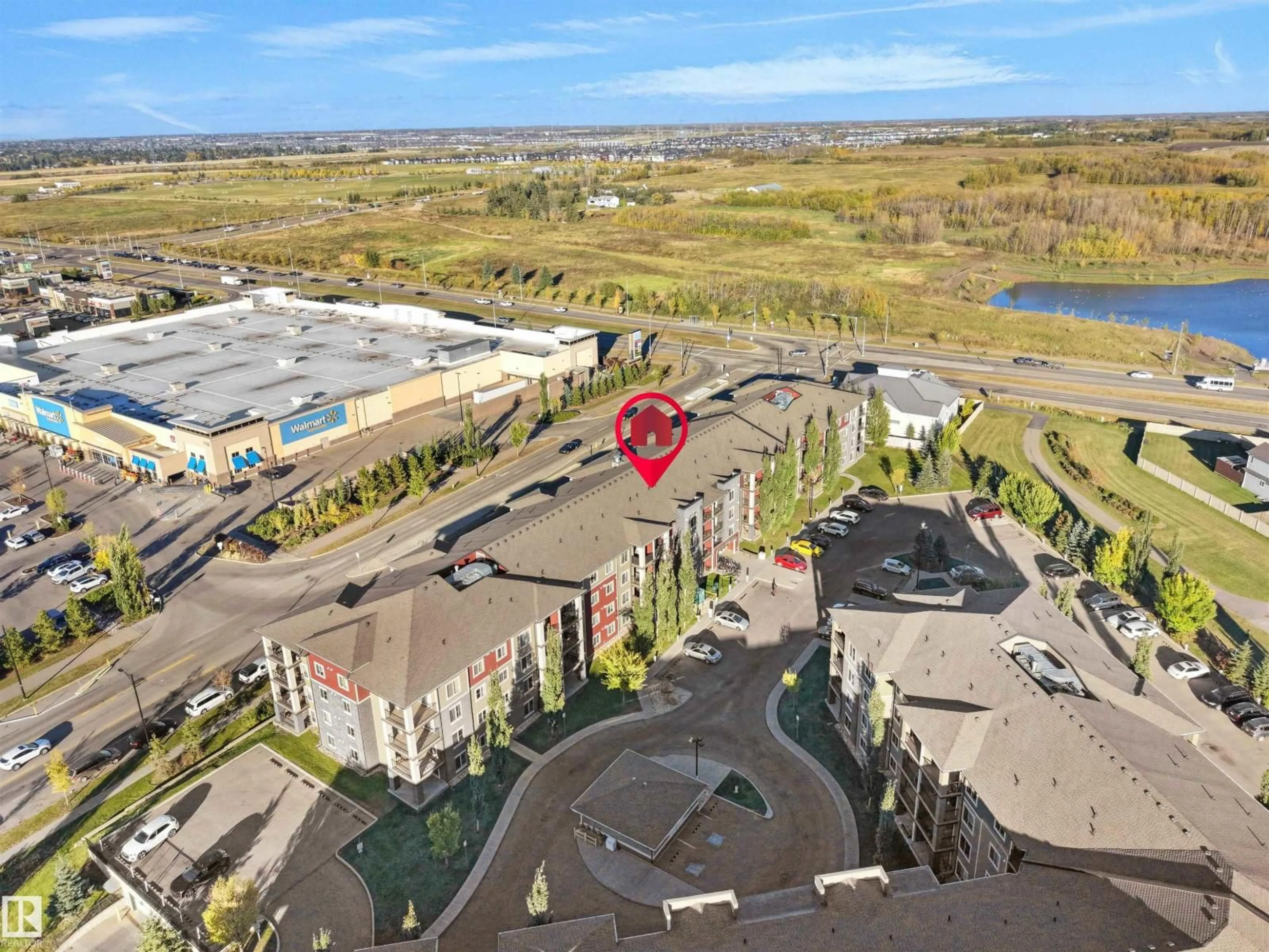A pic from outside/outdoor area/front of a property/back of a property/a pic from drone, unknown for 209 - 107 WATT CM, Edmonton Alberta T6X2C6