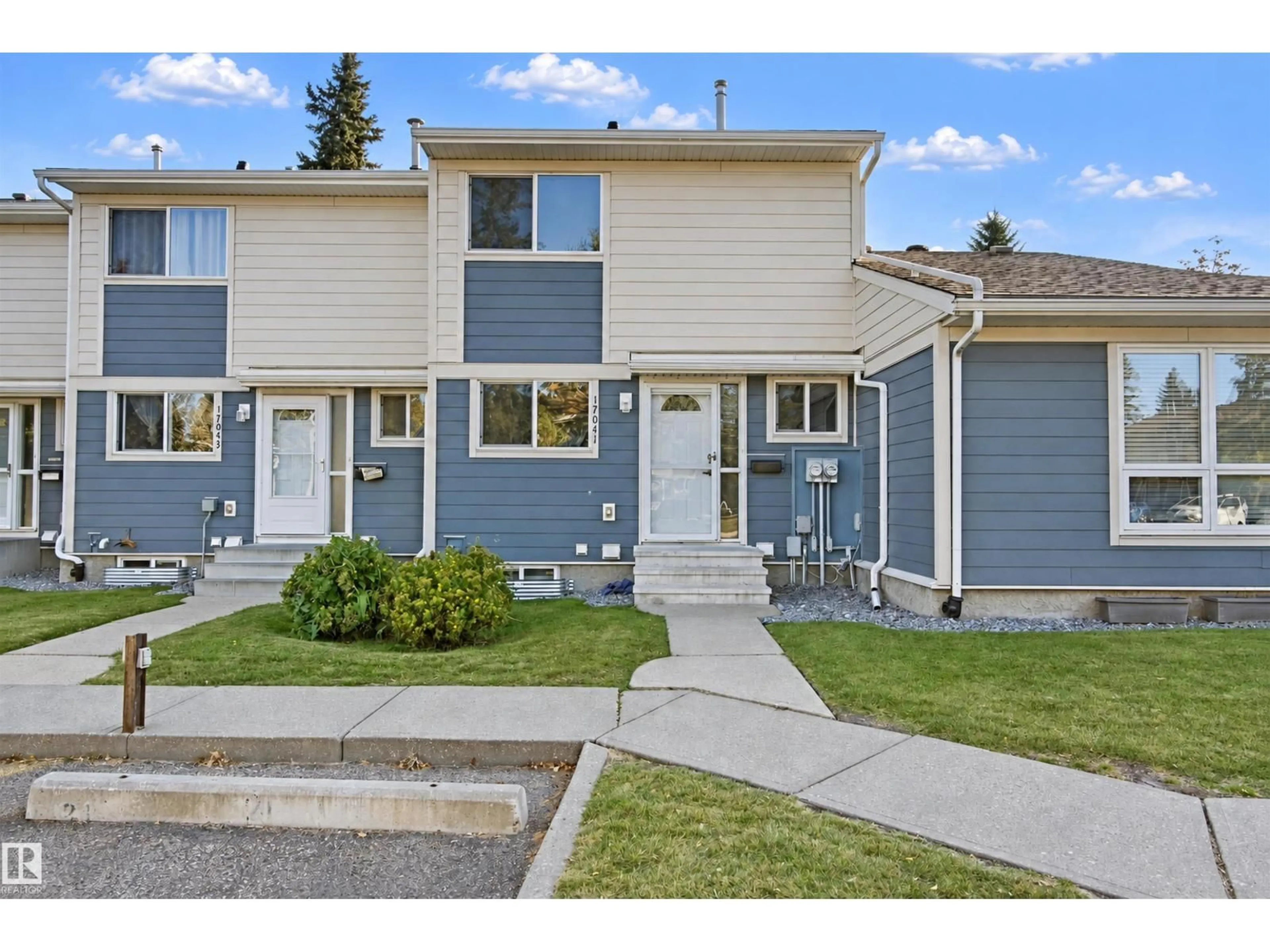 Home with vinyl exterior material, street for 17041 100 ST, Edmonton Alberta T5X4R8