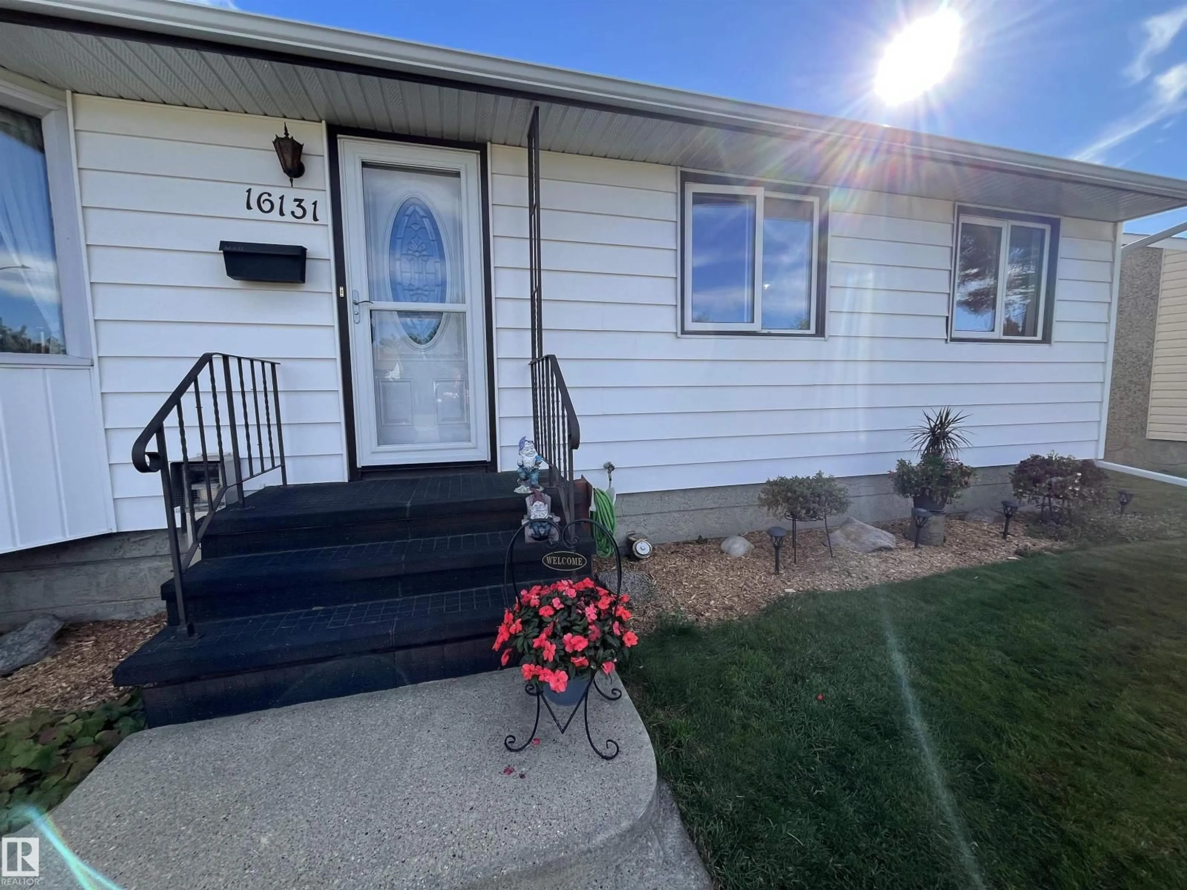 Home with vinyl exterior material, street for NW - 16131 110B AV, Edmonton Alberta T5P1J6