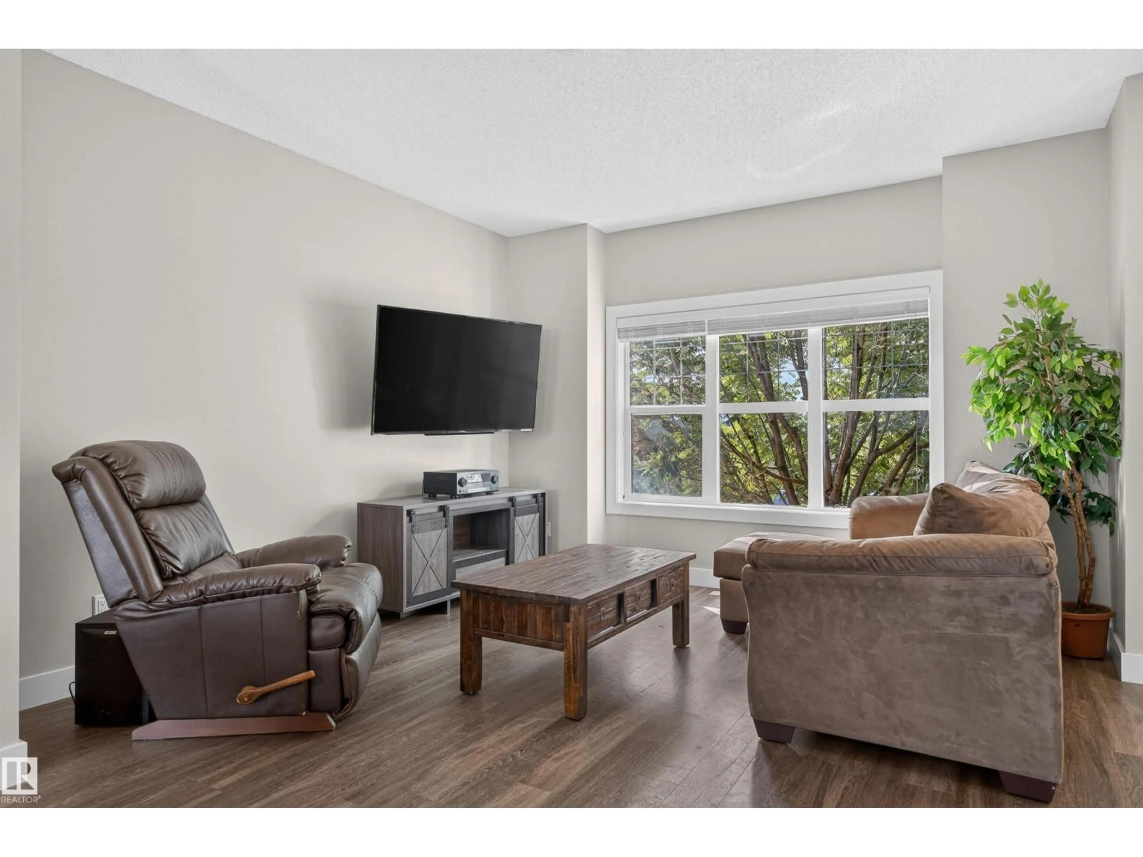 Living room with furniture, wood/laminate floor for LI NW - 9082 ROSENTHAL LINK, Edmonton Alberta T5T7A6