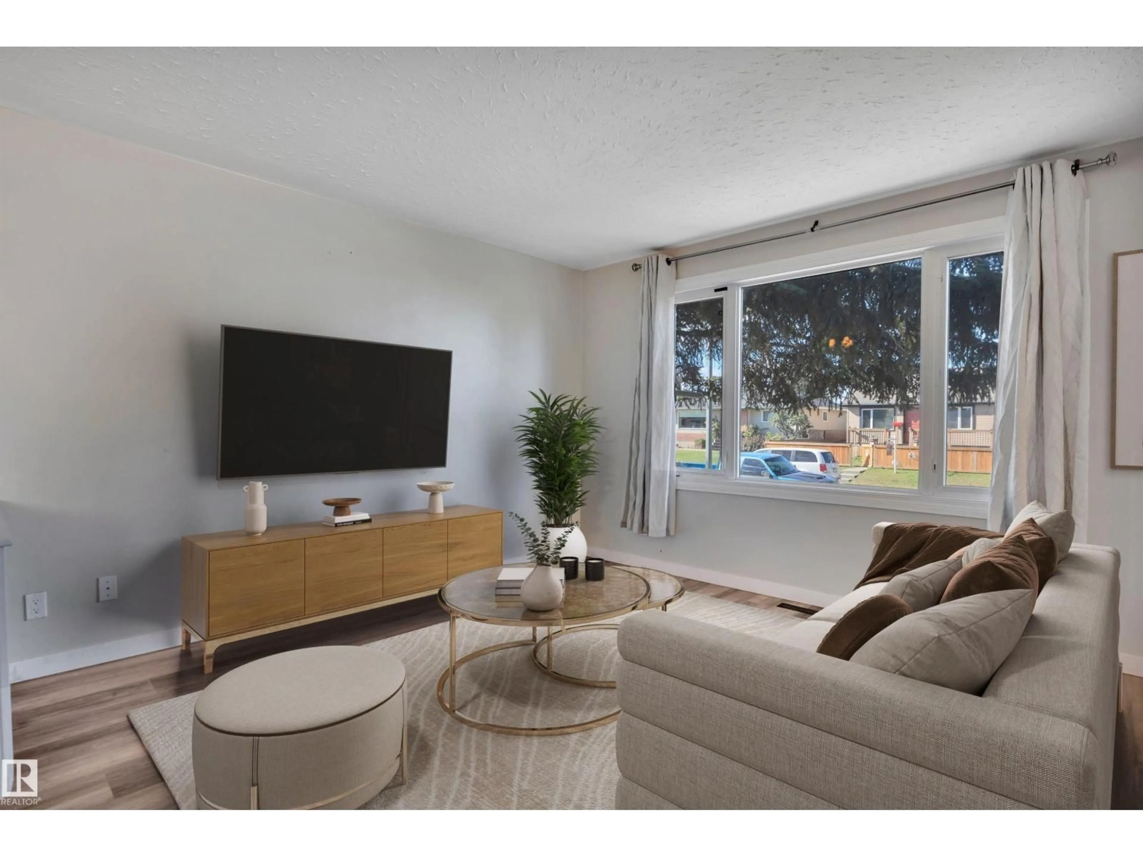 Living room with furniture, wood/laminate floor for NW - 13339 131 ST, Edmonton Alberta T5L1N8