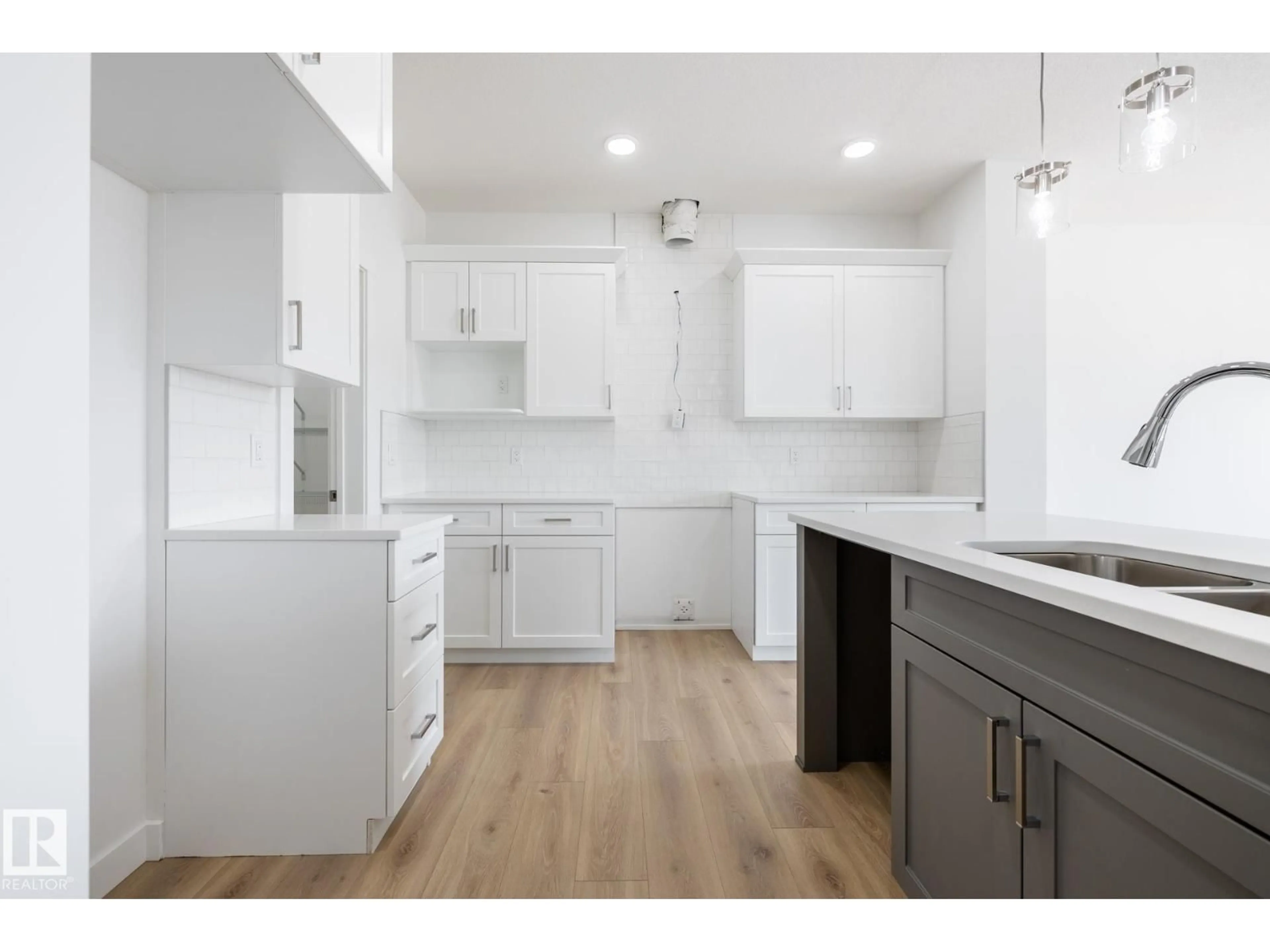 Open concept kitchen, wood/laminate floor for NW - 3036 197 ST, Edmonton Alberta T6M3L9