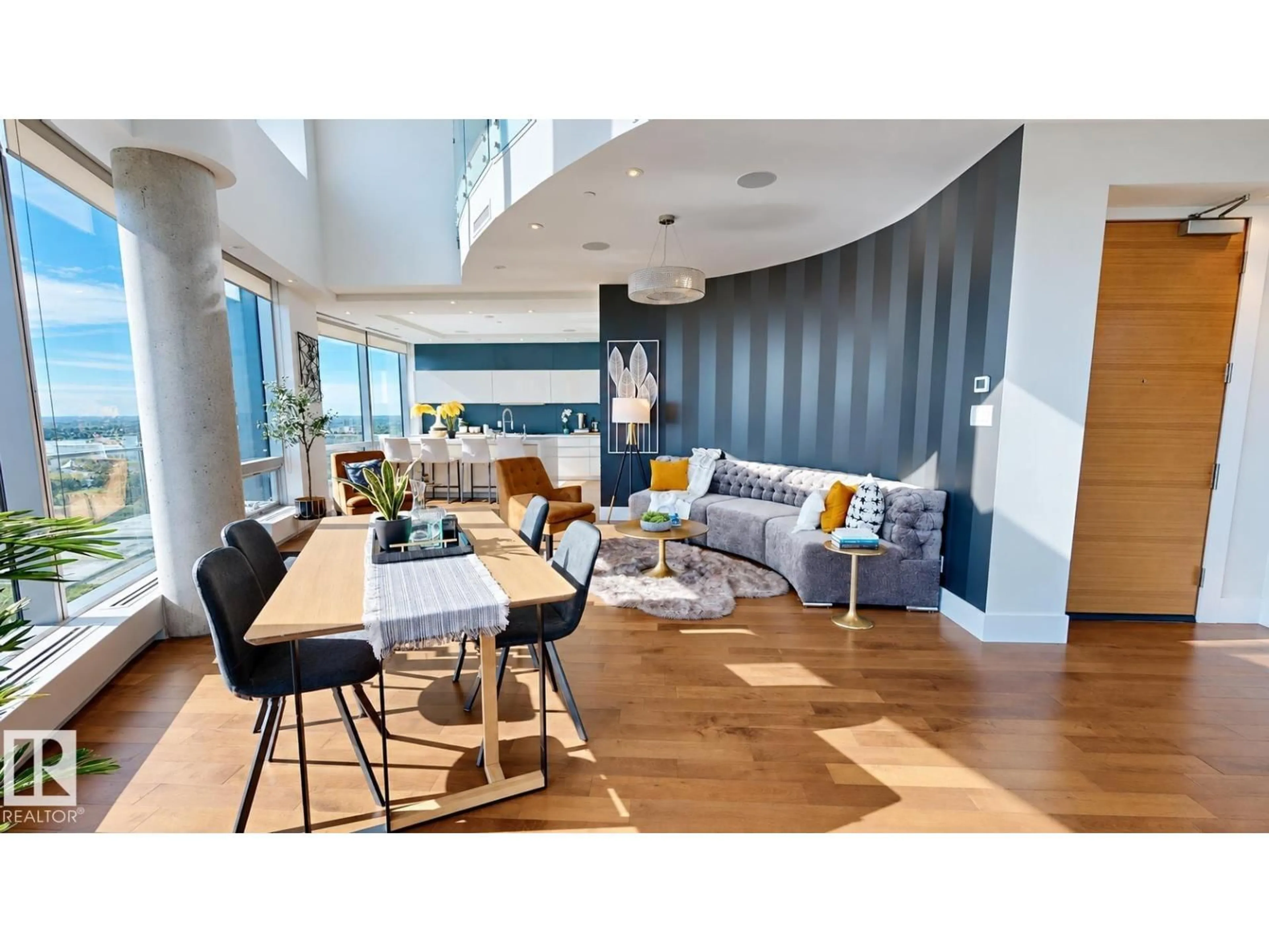 Living room with furniture, wood/laminate floor for 3201 JASPER AV, Edmonton Alberta T5K0P1