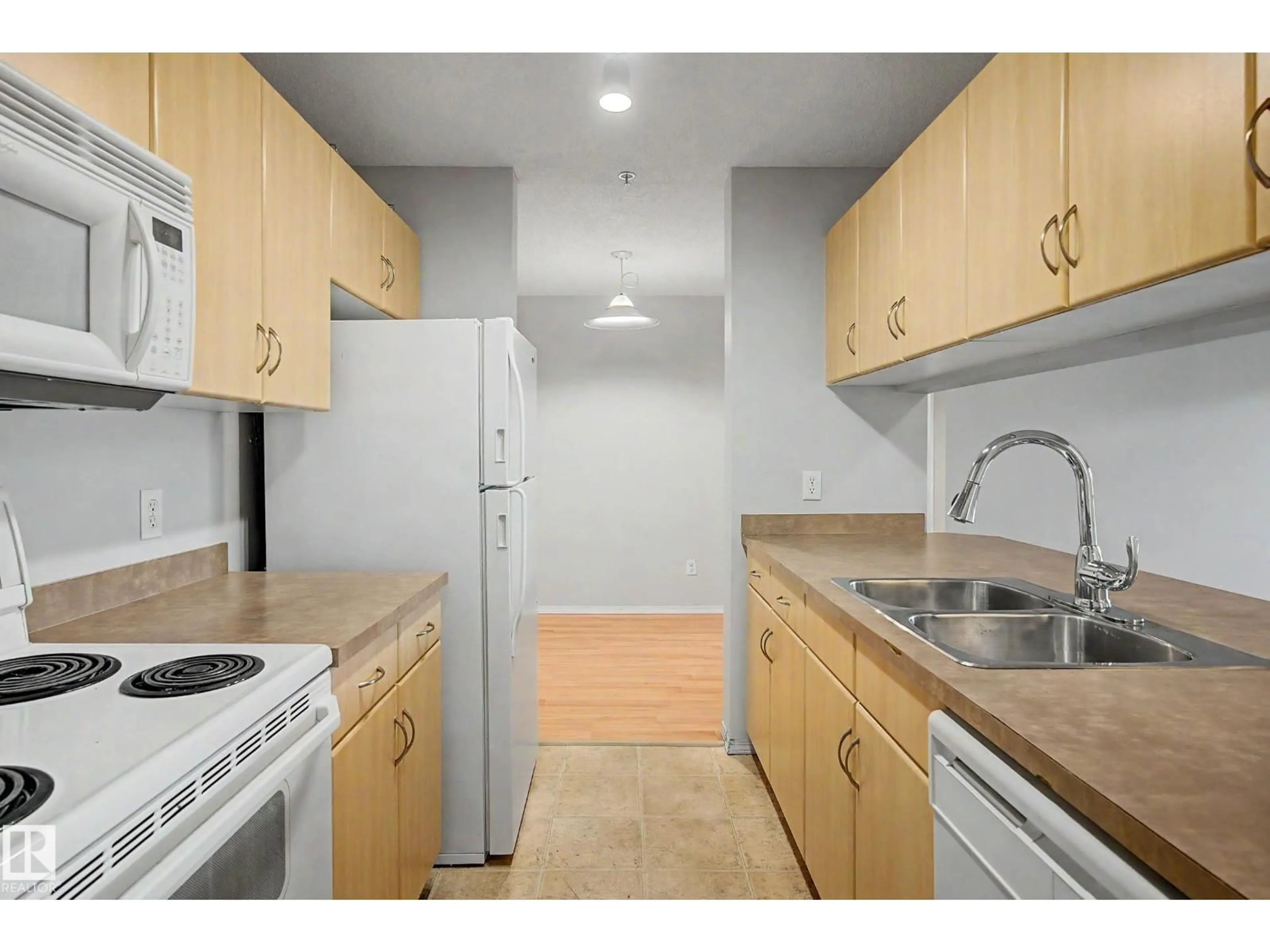 Standard kitchen, unknown for #204 - 2430 GUARDIAN RD, Edmonton Alberta T5T6X9
