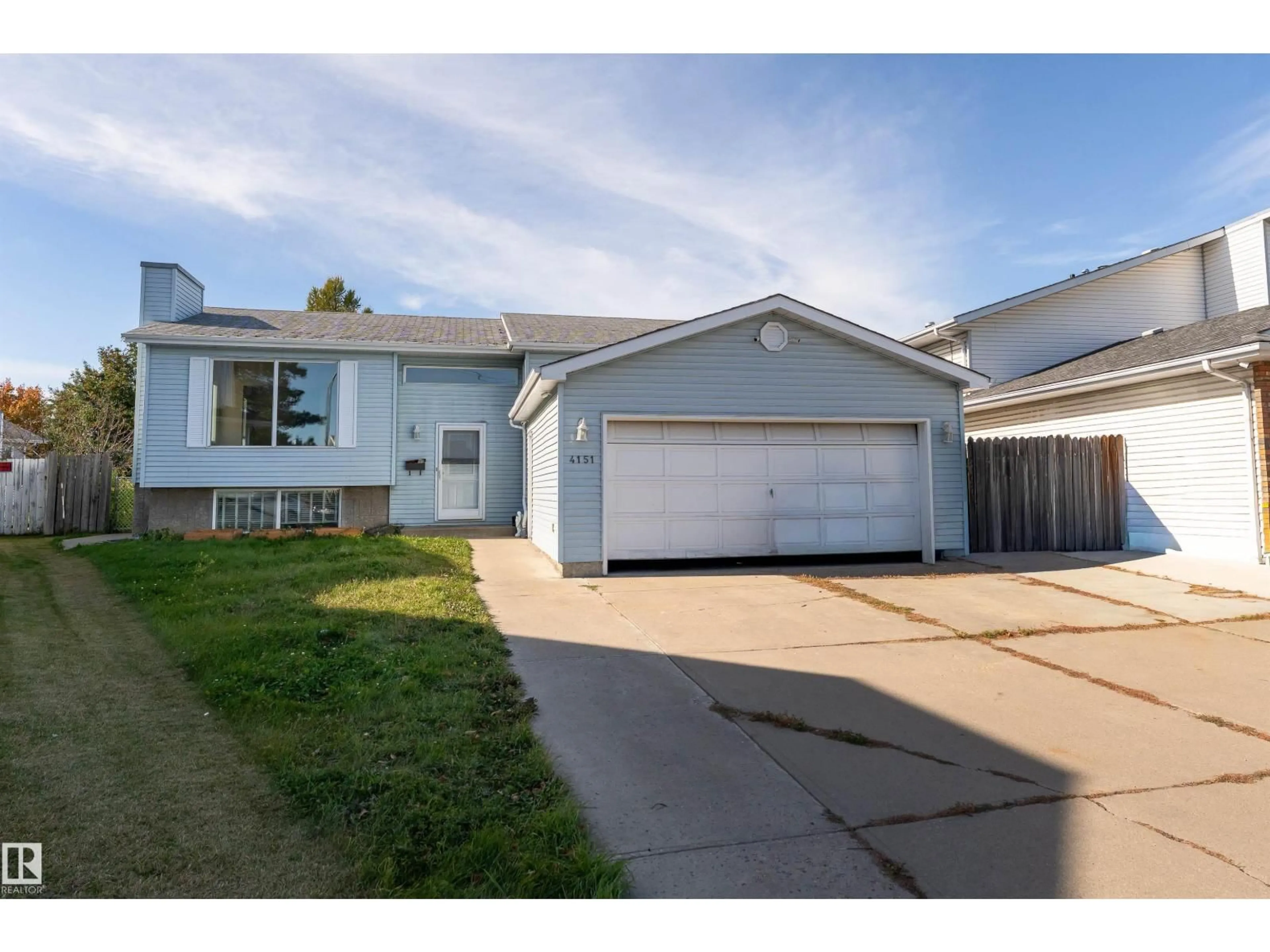 Home with vinyl exterior material, street for 4151 28 AV, Edmonton Alberta T6L4H2
